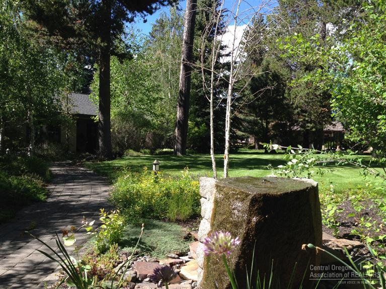 One of a kind Central Oregon mini-estate. 3+ acres immediate on the Deschutes River. Cascade Views, 200+ ft. of river frontage, grandfathered dock. Lovingly remodeled in 2002, new roof. Radiant heated, wood burring fireplace, hot tub, greenhouse, fully landscaped. 1.5 acres of irrigation with land, 2 more available for purchase.