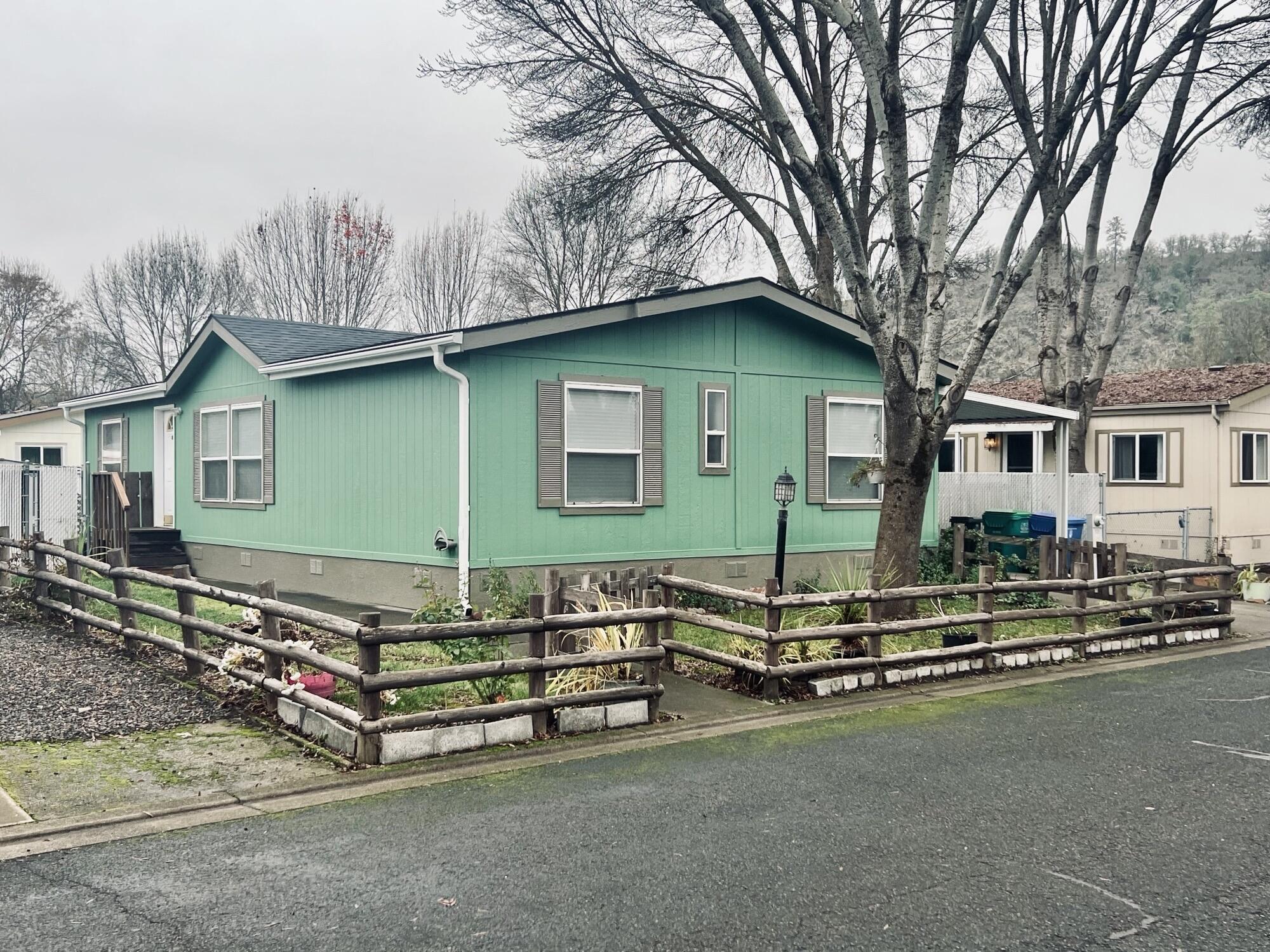 Beautifully maintained 3-bedroom, 2-bath manufactured home in the family-friendly Butte Crest Estates. Built in 1997 with 1,296 sqft, this home features a desirable split floor plan, open living area, and vaulted ceilings. The spacious kitchen offers an island, pantry, skylight, and ample storage, plus refrigerator, range, hood, and dishwasher. The primary suite includes a large walk-in closet, dual vanity, garden tub, and separate shower. Enjoy the light and bright nice-sized dining and living space, low-maintenance backyard with raised garden beds and shed, and a covered carport with ramp access. Pride of ownership shines throughout—truly move-in ready!
