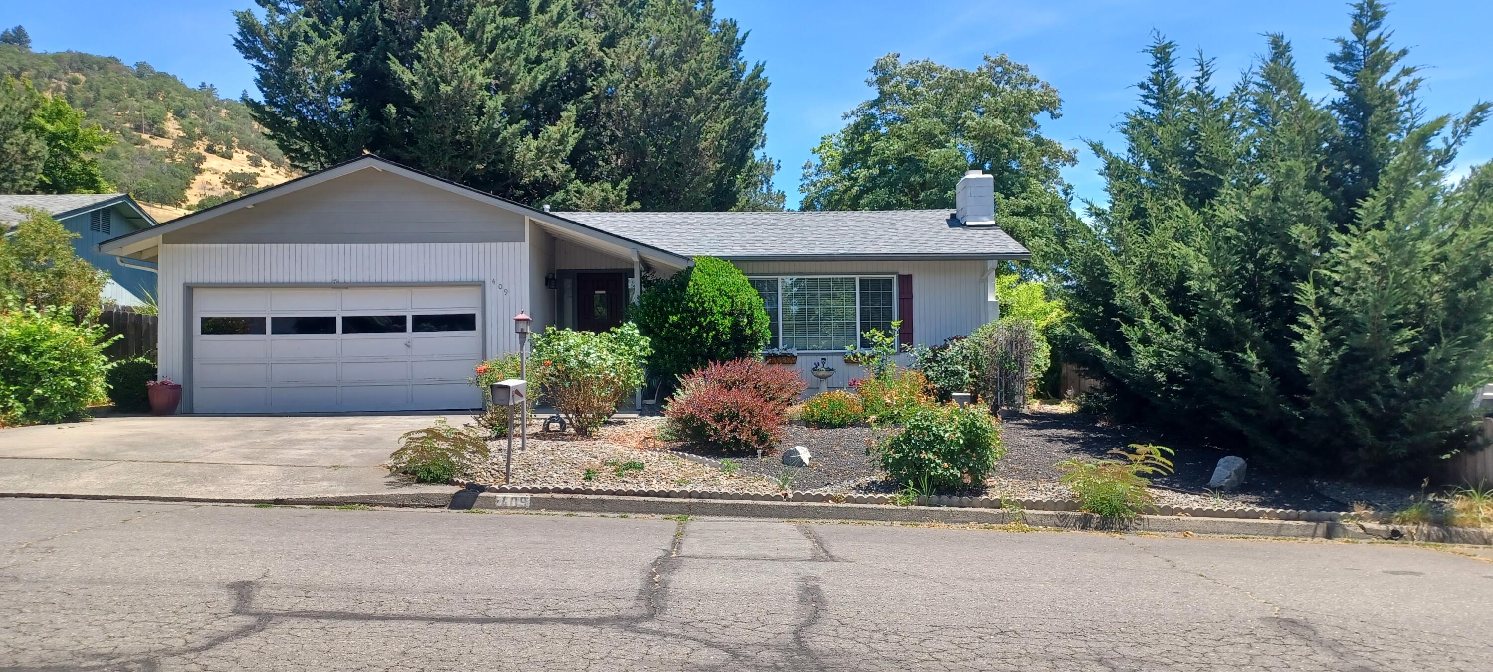 Great location near shopping, schools, dining and amenities! Well maintained and spacious 1753 SF home with 3 bedrooms and 2 full baths.  Front living area includes a cozy wood burning fireplace. Galley kitchen with breakfast bar and step down dining area. Second living area is a great space for entertaining guests. Primary bedroom suite features extra large walk-in closet. Attached double car garage. New roof 3 years ago.
Step out on the large size patio with several seating areas ready for your entertaining with family and friends. Then onto the over-sized backyard beautifully landscaped including raised beds. Attached storage shed is the perfect place to store your outdoor tools. Front yard beautifully landscaped for easy low maintenance. This lovely home is ready for new owners to make it your own and create your memories.
