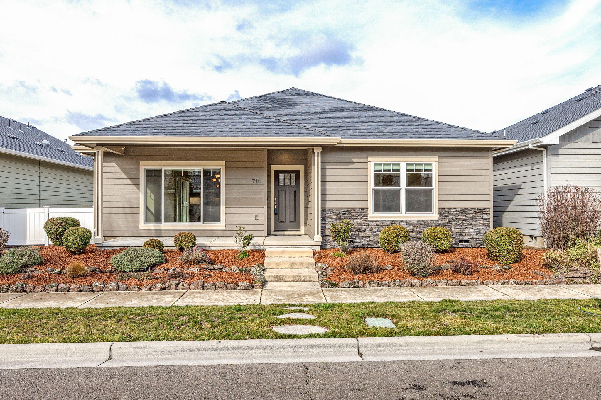Super cute standalone home in Twin Creeks Subdivision with many updates. This home looks amazing with an oversized 2 car finished garage with a deep sink and shelfing for extra storage.  2 primary suites with Carrera marble counters with 1 sink but plumbed for a 2nd sink in both primary bathrooms if needed.  Oversized tubs and showers. Coffered ceilings with fans. One suite has a walk in closet. Open floor plan in great room, dining room and kitchen with laminate floors, lg windows, canned lighting. Granite counters in the beautiful kitchen with undercount lighting, stainless steel appliances with 5 burner cook top and convection oven. Newer dishwasher, range & Air Conditioner and newer carpets in bedrooms.  Half bath off hallway for guests. Walk in pantry. Great covered porch plus cement patio with pavers. All fenced in side patio! Don't miss out on this one it is so nice!