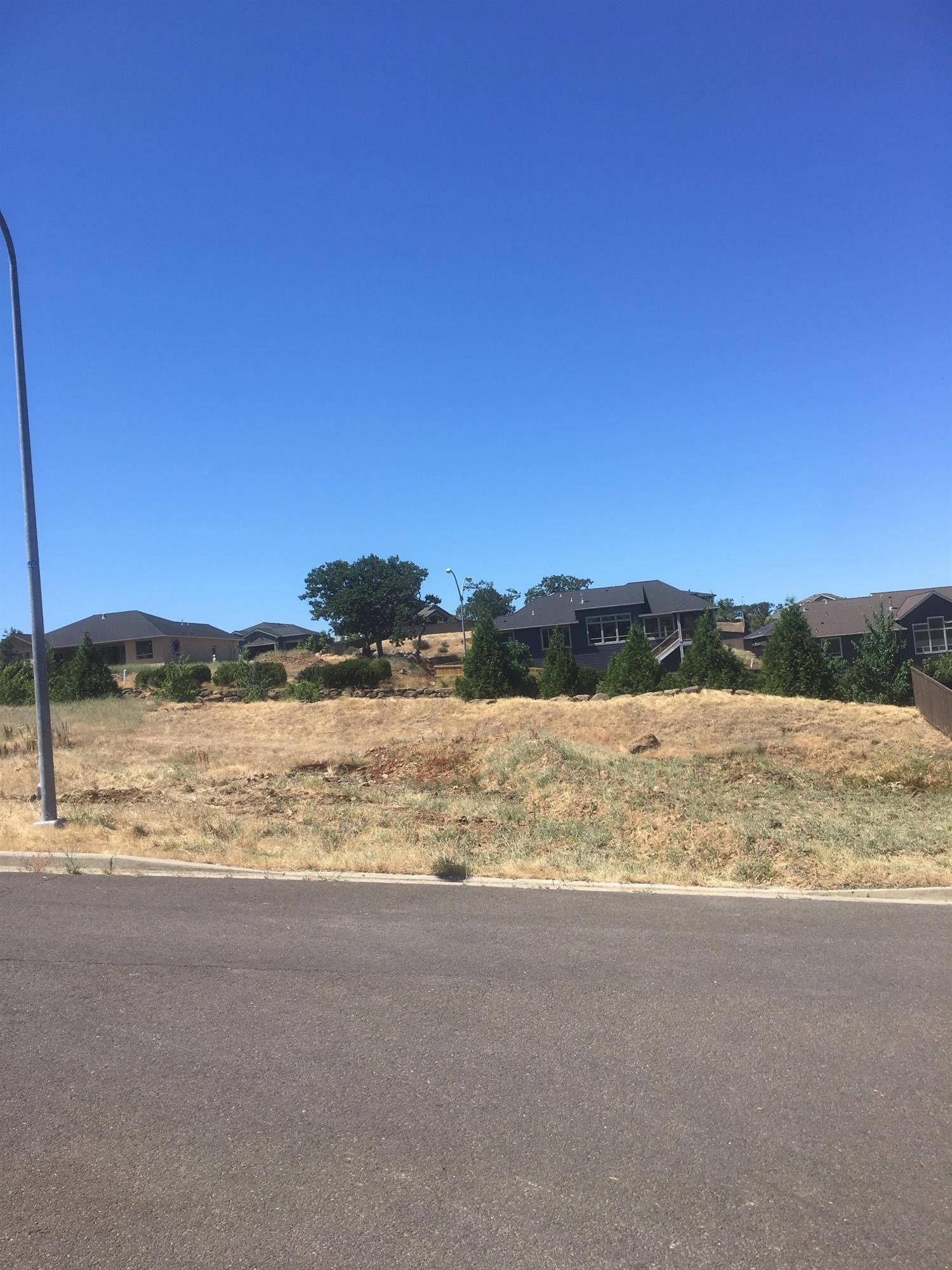 Welcome to Bella Vista Heights, Medford's premier subdivision site. Here you will find stunning views of the beautiful Rogue Valley, in one of the most desirable locations in town. We have homesites of varying sizes, to fit YOUR needs. One of the things that sets our sites apart from others is that we have NO minimum building square footage requirement. If you are thinking about building your dream home, you have FOUND the spot to do it. All building designs will need to be approved by the Architectural Control Committee. Please call the Rutledge Property Group today to find out how to get moving on this amazing opportunity! Lot 20.