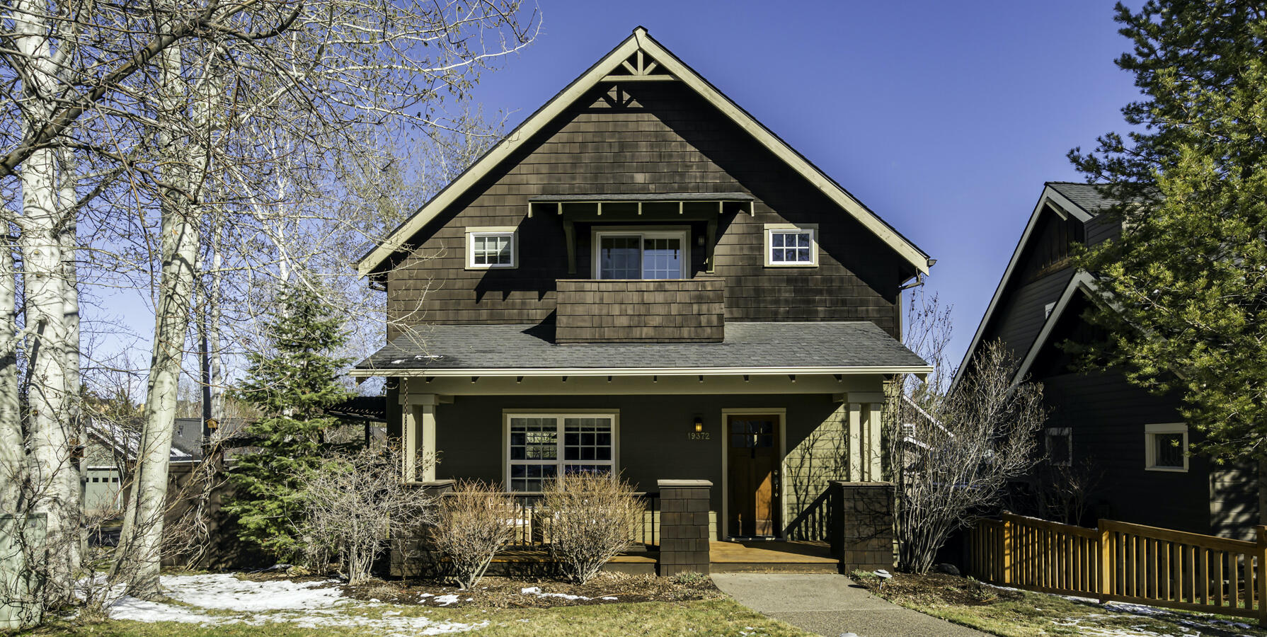 This beautiful home is ideally located in the desirable Braeburn neighborhood in SW Bend on the way to Mt Bachelor with the Deschutes River Trail and Phil's Trail complex a stone's throw away and only a 5-minute drive to the heart of town. The main level features a great room with stone fireplace flanked by elegant leaded-glass windows and plentiful storage that opens to the dining area, well equipped kitchen and a den or 4th bedroom with adjacent full bathroom. Three additional bedrooms with vaulted ceilings and two full bathrooms are located upstairs, including a primary suite with a private balcony. Outside, the large private deck with pergola, fan and gas firepit leads to a tiered fenced yard with mature landscaping, flagstone and pavers offering multiple areas to relax. The oversized 2-car garage with storage extending under the house and easy access to public lands, golf, restaurants, schools and shopping make this a perfect base camp to experience the best of Central Oregon!