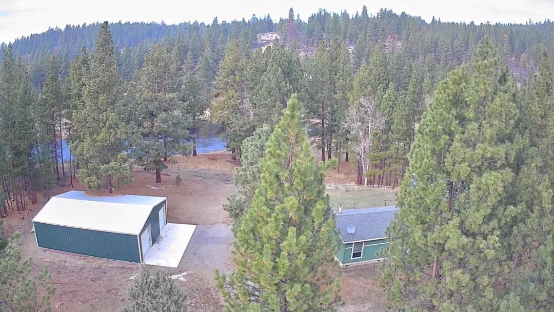 Beautiful manufactured home on the Sprague River. The home is 1900 sq ft of pure living space. The home is an open floor concept-- very cheery, stand at your kitchen window and watch the river flow by!!  The kitchen has all stainless steel appliances, as well as washer & dryer. This home is all set up with well, septic, propane, power from solar--- so no power bill!! Heat pump and pellet  stove keeps you warm in the winter. Mostly fenced with nice chain link fence  and gates. There are 2.77 acres of trees, a great view, 335 ft of riverfront plus the bonus is a heated 40X50 shop with concrete floor, 2 double doors and 2 man doors and heated with a pellet stove. Walk down to the river and rest on the bench and watch the fish jump and deer walk by.  This could be your forever home-- just come take a look. Price is right.