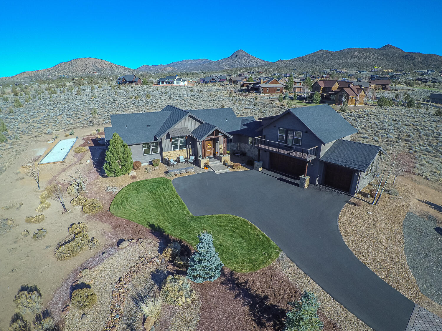 Custom built 2786 sq ft 3 Bdrm, 3 bath home plus bonus room with full Cascade Mountain views on the golf course side. Primary bdrm wing on the main level with nice separation from guest bedrooms.  Kitchen has granite counter tops, SS appliances, 6 burner stove, beverage fridge and Jennair refrigerator.  Visit with guests in the open concept great room which has a gas fireplace with blower, custom mantle with stone surround. Hardwood floors throughout. Upstairs has a guest bdrm, full bath, bonus room with a wet bar, along with a deck that captures the breath taking Mtn views.  This space makes for a great guest quarter or rental space. Outside you can enjoy any one of the three patios, play a game of bocci ball or toss horse shoes while taking in the snow capped Mtns. Lot has enough space to build an ADU. Brasada has year round amenities for the entire family, including 3 pools, athletic rooms, kids activity center, golf, outdoor sport courts, 2 restaurants and general store
