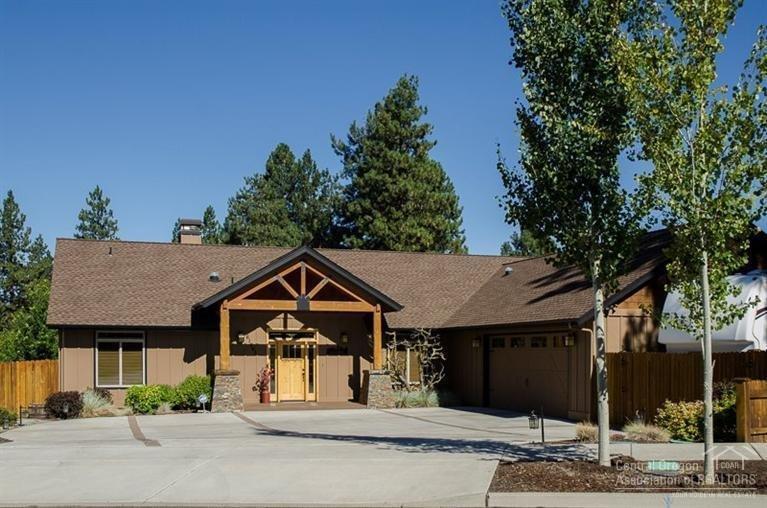 Spectacular 2,209 sq ft custom home on the canal in beautiful Ladera neighborhood. This 1-level 3BR 3BA lodge-style home lives much larger than many bigger homes. Huge 3-car garage w/extra shop space, RV parking w/plug-in & a low-maintenance yard with no lawn to mow! Vaulted wood ceiling, hardwood flrs & stacked-rock fireplace in great room. Chef's kitchen w/granite countertops & tile backsplash & tons of custom cabinets. There is exceptional quality everywhere you look! Ask for list of all the upgrades!