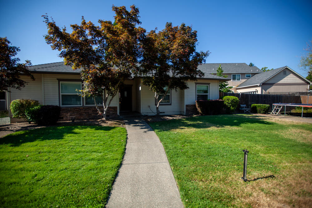 Welcome to 2082 Lower River Rd - a fantastic opportunity just minutes from downtown Grants Pass!
This well-located home offers both comfort and value in a desirable neighborhood close to Reinhart Volunteer Park, shopping, dining, and schools. The primary suite features a spacious walk-in closet and sits just off the open-concept living area, complete with vaulted ceilings and a kitchen bar perfect for casual dining or entertaining.

Enjoy the outdoors in the large, fully fenced backyard — ideal for pets, play, or gardening. Whether you're a first-time homebuyer, downsizing, or investing, this property offers convenience, functionality, and a great Grants Pass location at an affordable price.