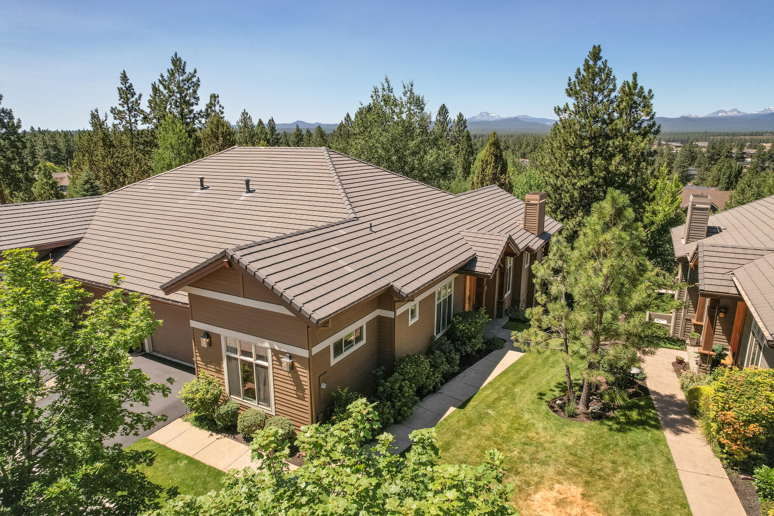 Stunning NW Bend townhome, completely remodeled with breathtaking attention to detail. 2120 sqft includes 2 bedrooms, 2.5 baths, plus an office/den. The open floor plan boasts soaring ceilings, natural stone clad wall accents, oak flooring, and reclaimed hand hewn wood beam accents throughout. Chef's kitchen features Carrera marble & granite countertops, center island & breakfast bar, Thermador appliances, & custom cabinetry. The spacious great room boasts a dining area, stone surround fireplace, custom built-ins, and picture windows. The master suite has private access to the back deck, walk-in closet, and a giant walk-in shower. Guest bedroom includes an ensuite bath with a beautifully tiled shower. Expansive covered deck is the perfect place to relax or entertain, and enjoy the seasonal Cascade Mountain views. This home truly belongs in a magazine! Great location, just minutes to river access, Downtown Bend, the Old Mill, and Northwest Crossing.