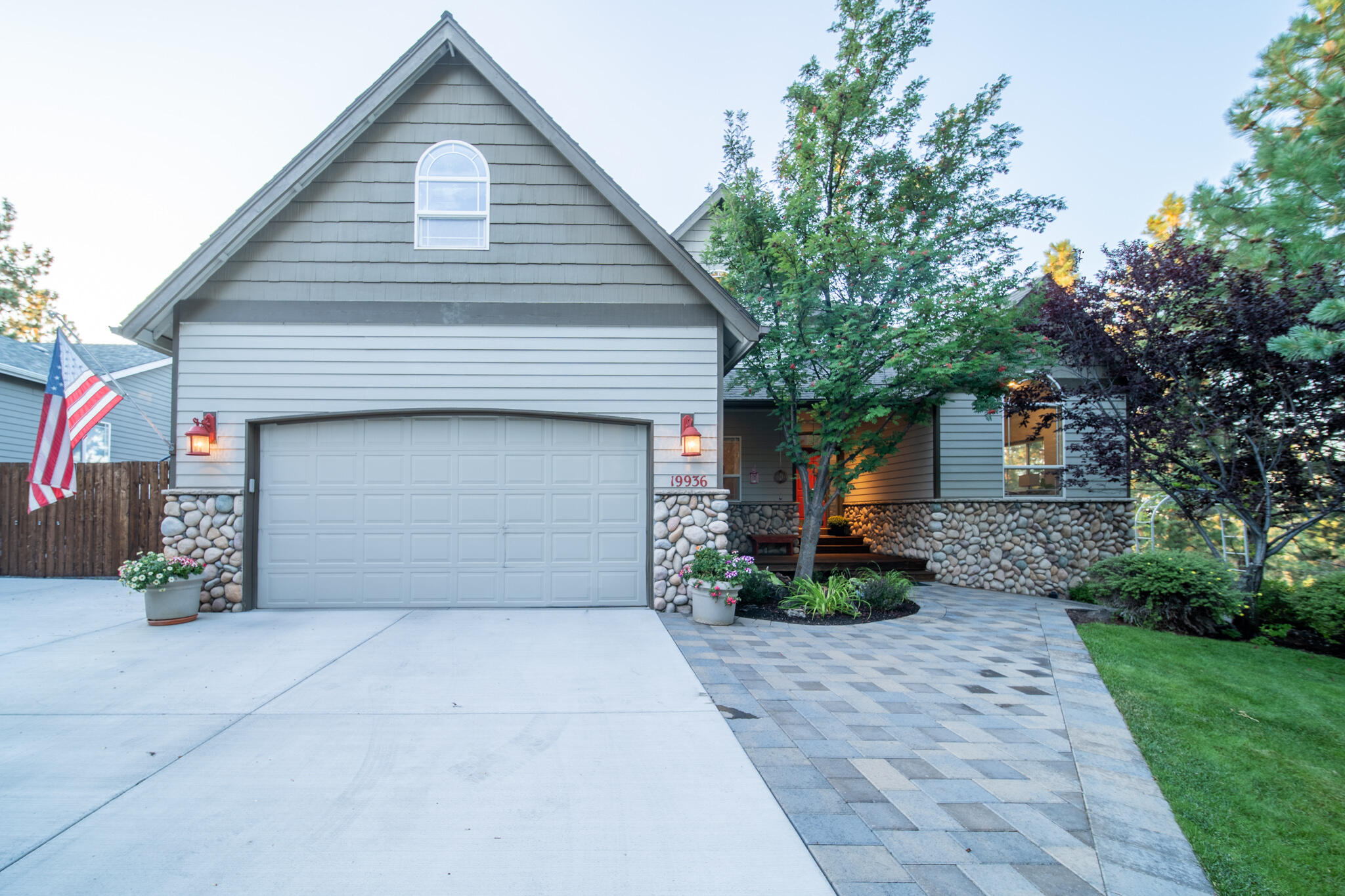 This immaculate home is perched on a 1/2 acre lot that provides spectacular Cascade mountain views in a private setting steps away from the Deschutes River Trail System. The property provides beautiful views from virtually every room in the house. The traditional layout has the main living areas downstairs with four bedrooms and a bonus room upstairs. The generous primary bedroom includes it's own deck with panoramic views to enjoy amazing summertime sunsets. The updated kitchen and brand new wet bar provide easy access to the generous backyard that is an entertainer's dream. The tranquil yard was thoughtfully designed to optimize the views and has a beautiful water feature, multiple deck areas, a finished stamped concrete patio, grass play area and hot tub. This home also provides ample storage including a three-car tandem garage and huge side yard for RV/boat parking. Numerous recent improvements include paver pathway, raised flower beds and a new driveway in 2018.