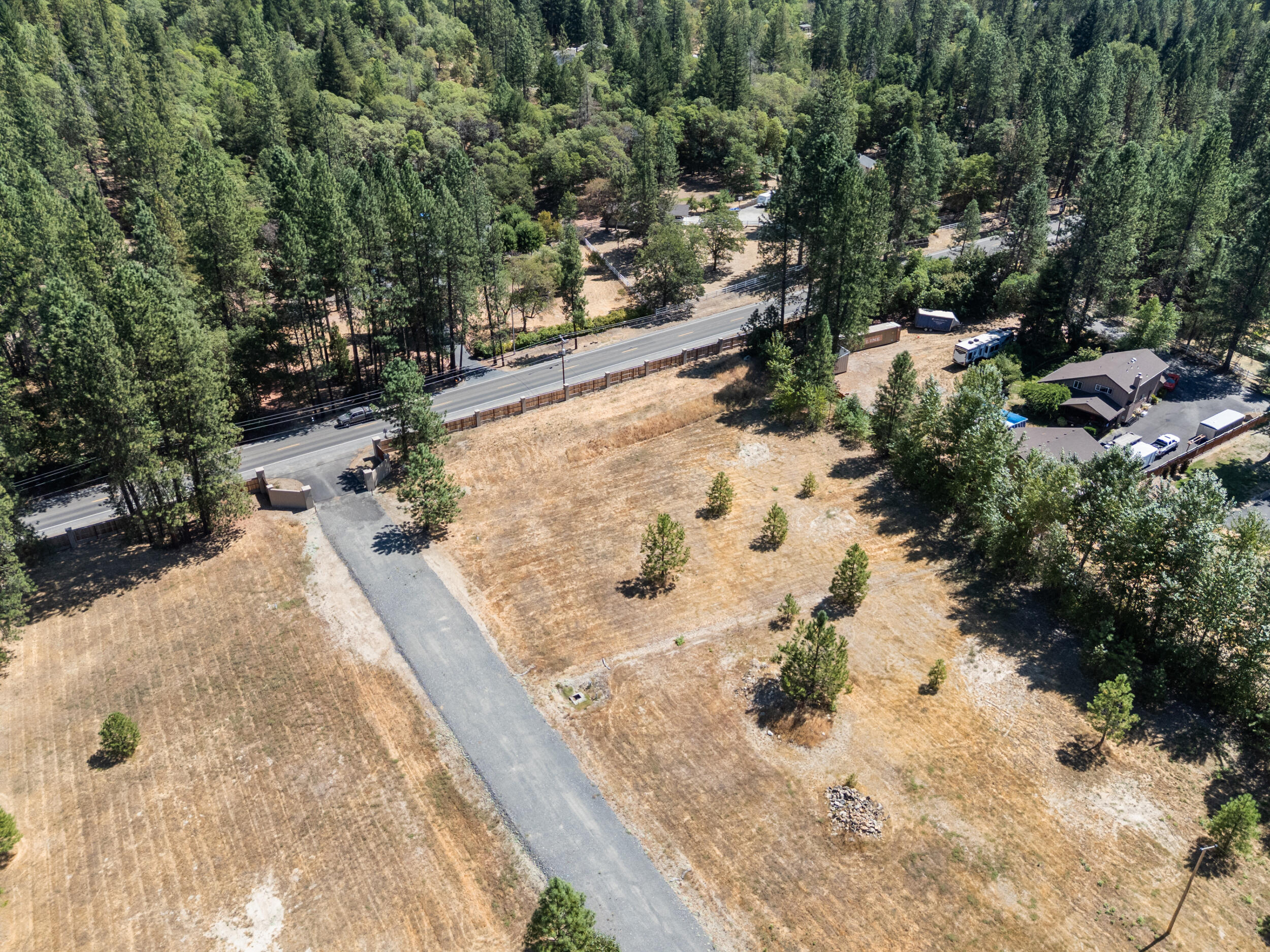 Value lot, right off E Evans Creek Rd and completely level and ready to build. Well is in. Septic approval is done. Choose your builder or buy and hold for the future. Rare, level 1 acre rural buildable lot. In an area with nice homes. All utilities are plumbed underground. The perfect blend of rural elbow room and not too far out from town. Conventional lending available with 20% down.