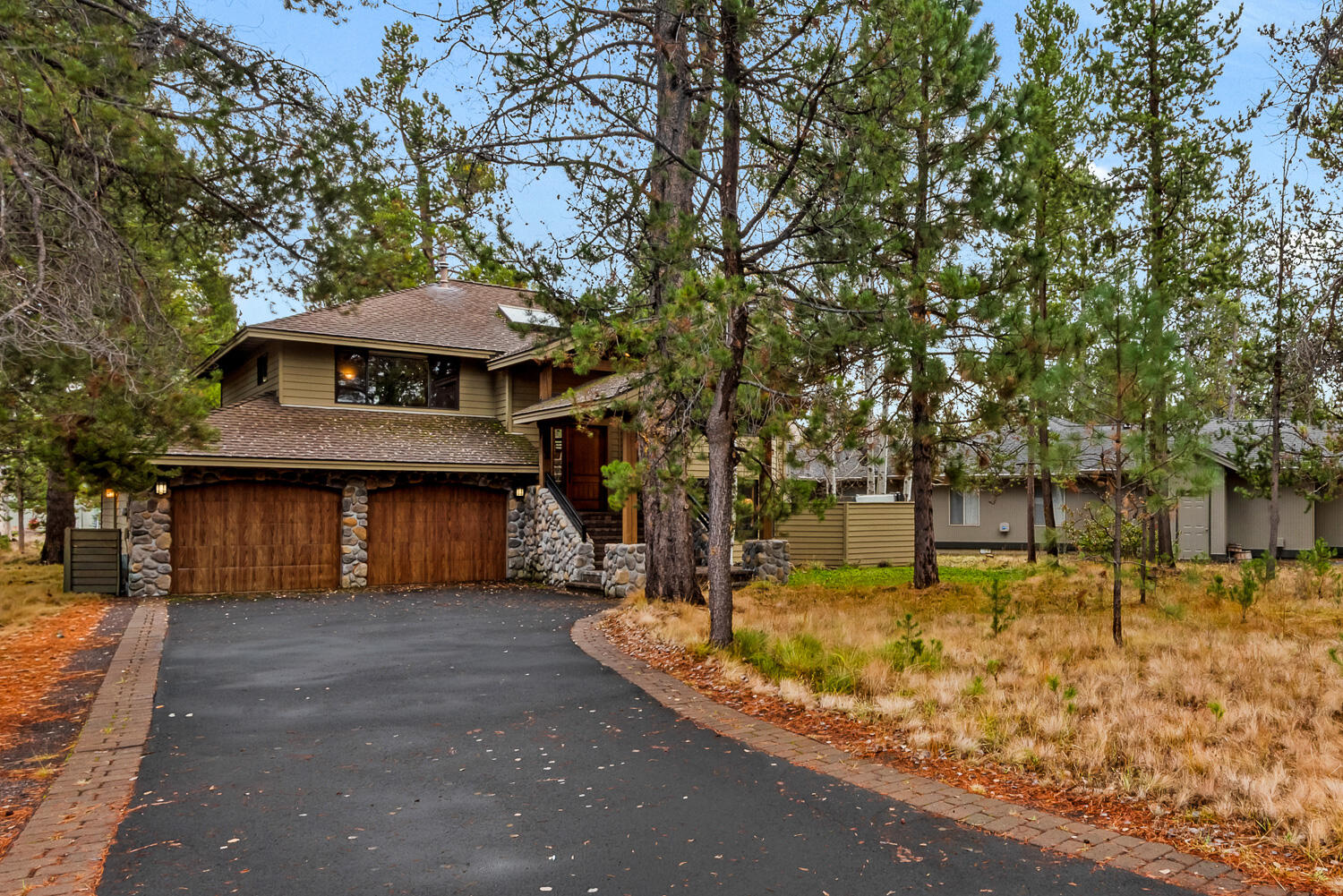 A Sunriver Gem
An impressive stone entry sets the tone for the refined perfection within. Thoughtfully crafted, the open-concept great room invites connection, flowing effortlessly to an outdoor living sanctuary designed for relaxation and entertaining beneath the pines. This is the essence of the Sunriver lifestyle—where nature, design, and comfort converge.
The primary suite on the main level offers a serene retreat, while a spacious secondary master, guest suite, and bonus room ensure comfort for all. A private second outdoor living space and hot tub extend the experience under the stars. Offered turn-key furnished, this remarkable home captures the timeless appeal of resort living at its finest.