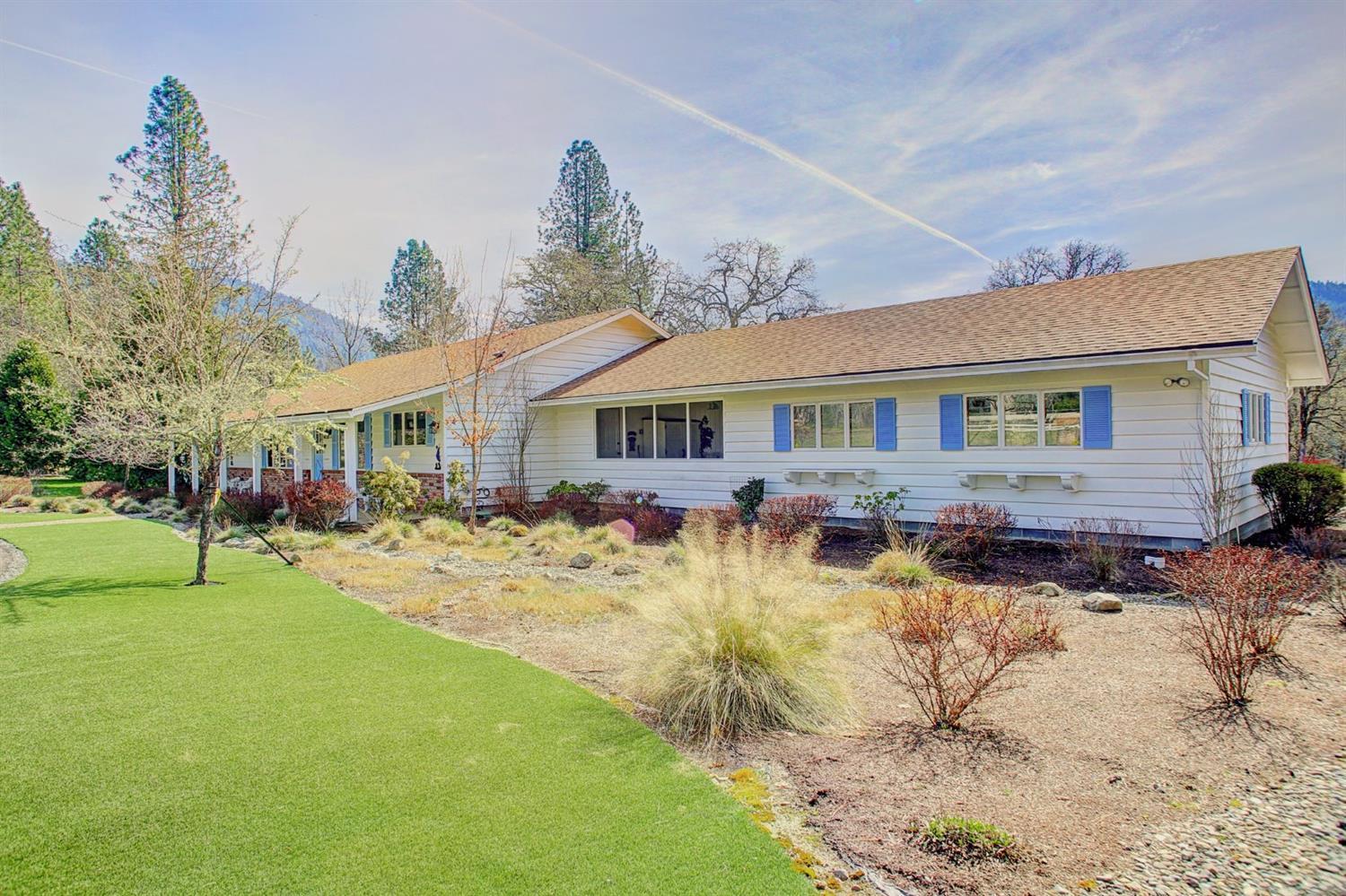 Are you looking for a beautiful, level, country property in an excellent area with a great well and amazing views? Here it is! This 2252 sq ft 3 bedroom, 2 bath ranch style home sits on a 2.6 acre property with a seasonal creek on one side. The home is exceptionally well-maintained and loved by the current owner. The spacious kitchen connects to a nice dining area and very large living room with cozy wood stove. The sliding doors open to a low maintenance deck. There is a nice laundry area and huge walk-in pantry. The oversized 2 car garage with storage and work space is separated from the house by a screened in sun room''. The large 26x52 shop is designed for RV storage. The landscape is low maintenance with drip system. Well was 20 GPM when last tested. 1 Year home warranty for buyer.