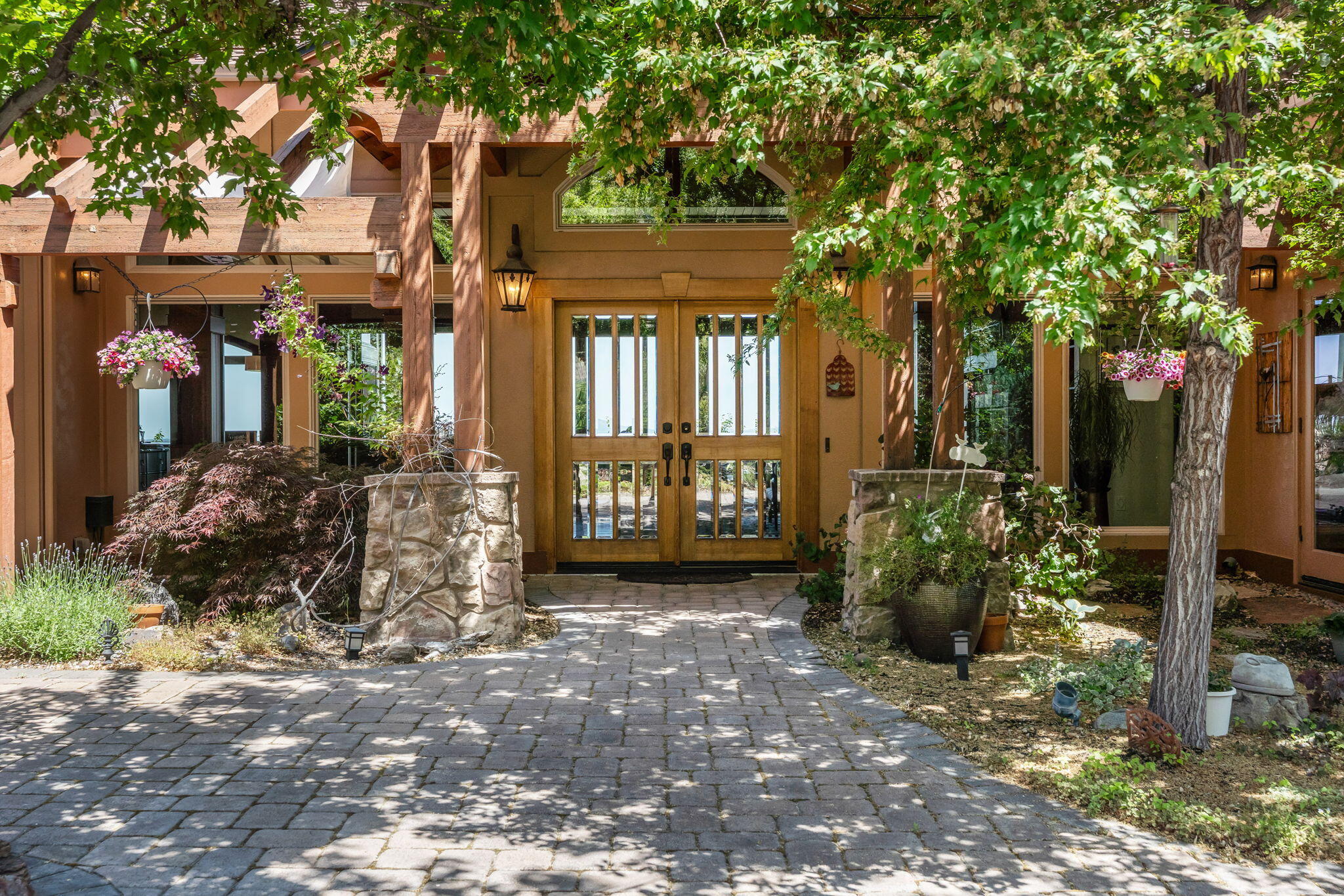 This stunning home offers the ultimate privacy & expansive mountain views from Smith Rock to the Cascades. A gated entry leads through a beautifully pavered, enclosed courtyard with a bubbling water feature. A double door entry to the home welcomes you into the spacious great room with mesmerizing, expansive views, gleaming hardwood floors, raised hearth stone fireplace, wood beams, wood wrapped windows & an accordion 4 panel sliding door which opens to the view deck for seamless indoor/outdoor living. The gourmet kitchen with Jenn-Air double ovens & leathered slab granite counters offers timeless yet modern design with attention to every detail. The selective Italian tile flooring throughout is outstanding for Central Oregon living. A large and private Primary Suite is an oasis with spectacular views, 2 walk-in closets, jetted tub, fireplace & radiant heated floors. Office with separate entry to the enclosed courtyard. 3 car garage with epoxy floor & heated driveway for convenience.