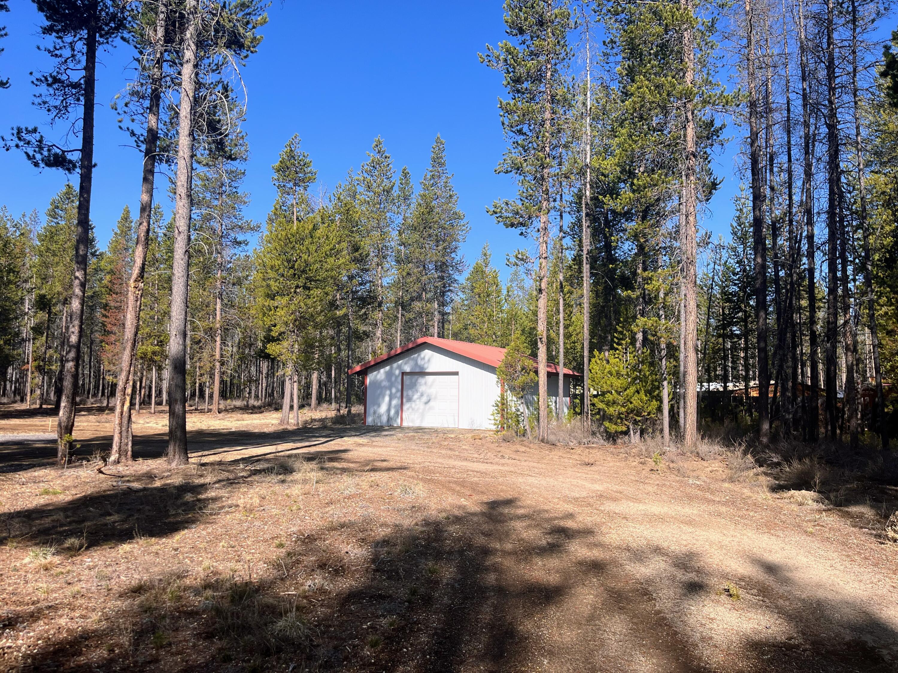 This stunning property spans 1.80 acres and is equipped with water, septic, and power. It includes a 25x25 garage with a roll-up door, a circular driveway, and a well-cleared lot, making it ideal for building your dream home.
The property also features two separate septic hookups. The septic system is just one year old and has been approved for a three-bedroom home. Additionally, there is sufficient power and water available for two full-service campsites.