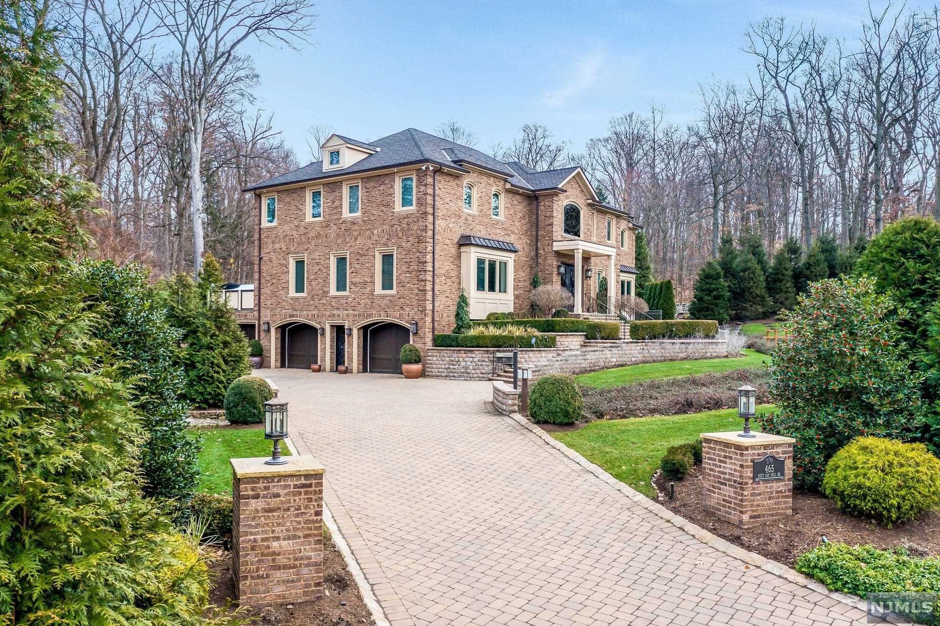 Nestled in the prestigious East Hill of Englewood and minutes from the George Washington Bridge to New York City, this ten-year-young home is a custom masterpiece with the finest interior design and architectural elements. With over 8,000 square feet of living space, this upscale and elegant residence boasts bespoke craftsmanship, premium finishes, and a chic style throughout. Center hall with grand two-story entry, banquet sized dining room, gourmet kitchen at the heart of the home with oversize island and coffee bar, exquisite primary bedroom with spa-like bath, lower level with temperature-controlled wine room and gym. Property is resort like with total privacy, gunite pool with spa, and over-the-top outdoor entertaining options. Special features include unique ceiling details/tray ceiling in every room, radiant heat throughout, whole house generator, and smart home features, so every control is in the palm of your hand. No detail is spared in this home.