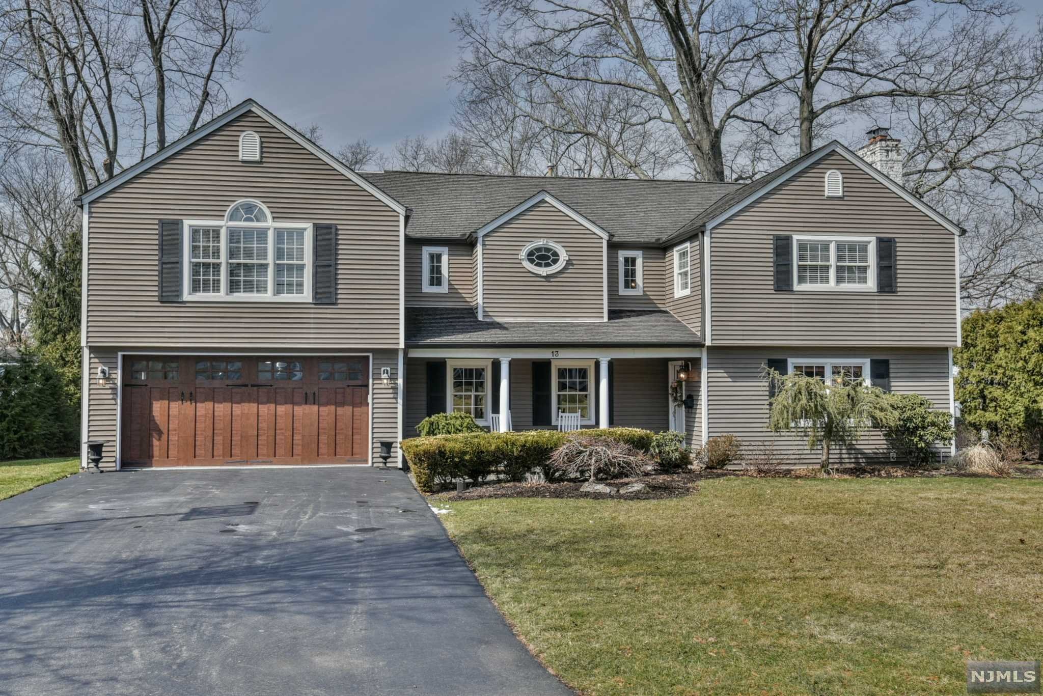 Warm & inviting, this professionally decorated, clubside colonial is situated on an oversized lot on one of the most desirable streets in Ramsey Golf & CC. An entertainer's dream, the welcoming flow of this home draws you in from the start w/custom millwork beginning w/the entry foyer, library/LR with f/p, & office. Continue to the back to find a beautiful chef's kitchen w/an expansive island, high end appls & custom cabinetry. Entertain guests between the formal dining room & 50' of open-concept kitchen/great room w/2nd gas f/p. French doors lead to a light-filled conservatory/playroom. Upstairs are 3 generously sized BR's w/FB & laundry. Located on its own wing, you'll find the primary suite w/vaulted ceilings, palladium windows, walk-in closet & spacious ensuite bath. No detail was spared including a full finished basement. Coupled w/the Club lifestyle & close to the vibrant downtown and commuter train station, it doesn't get better! Membership req'd.