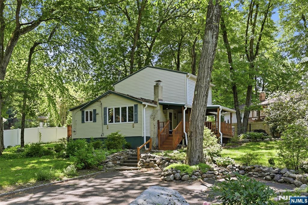 Welcome to the peaceful lifestyle of Fayson Lakes! Tucked just around the corner from the water, this inviting 2-bedroom home offers the serenity and charm that make this lake community so sought after. Step inside to a warm and welcoming dining room with fireplace that moves into an open living room - an easy, comfortable layout made for everyday living and relaxed entertaining. The updated kitchen with convenient side entrance keeps things functional, and the main full bath includes a handy laundry closet. Doors off the living room lead to a paver patio overlooking the koi pond, while the deck offers an inviting sitting area - the perfect spot for morning coffee or unwinding at the end of the day. Lake membership is required, opening the door to swimming, kayaking, and the year-round social calendar that gives this community its special character. Whether you're downsizing, starting out, or searching for a weekend retreat, this is a wonderful opportunity to embrace the charm and connection of lake life. Please confirm all fees. Fireplace as-is.