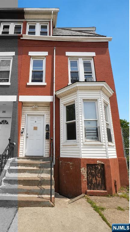 Welcome to this stunning brick brownstone nestled in the heart of Newark, NJ. This fully updated 2-unit multifamily exudes that coveted NYC and Jersey City brownstone charm, sitting on a 16.6x86.3 lot featuring a full basement and parking. Thoughtfully renovated in 2025 with modern finishes throughout, this property offers 5 bedrooms and 3 bathrooms across both units, with both currently tenant occupied and generating consistent rental income from day one. Perfect for the seasoned investor seeking immediate cash flow or an owner-occupant looking to live in one unit while collecting rental income from the other. Experience the charm and character of classic brownstone living at a fraction of NYC and Jersey City prices with low 2025 taxes. Conveniently located with easy access to major highways and NJ Transit for a seamless commute to NYC. Property can be purchased individually or as part of an exclusive package deal with 4 additional side by side brick brownstones on S 12th St totaling 5 properties. Opportunities like this do not last. Schedule your showing today.