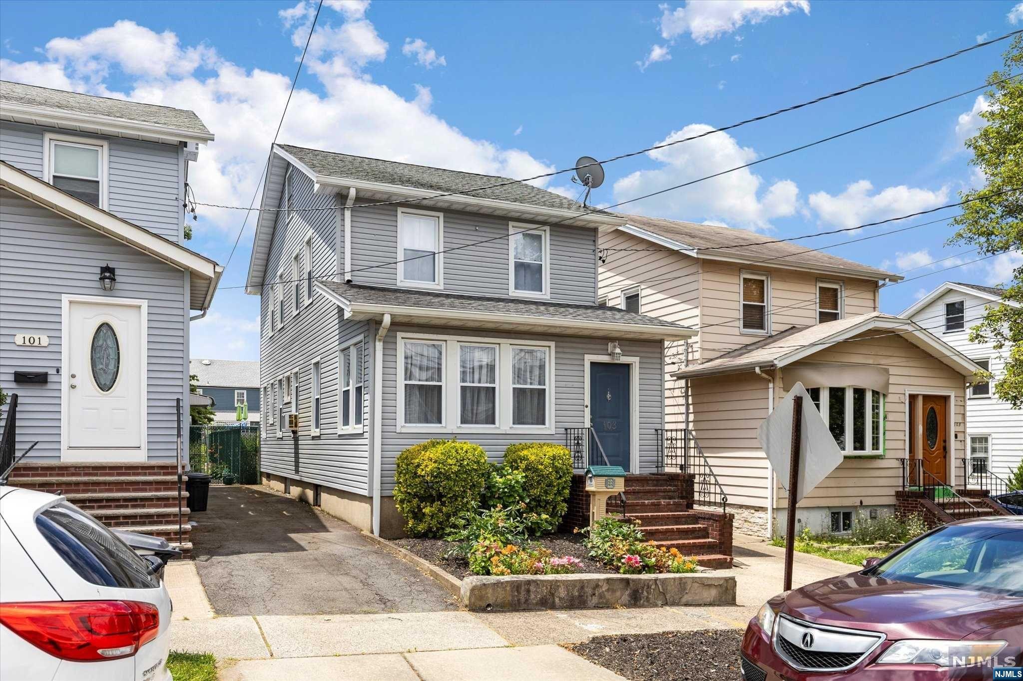 Spacious 3 Bedroom Colonial home with a long driveway and one car garage. Parquet wood floors on the 1st floor, half bath, office, or family den. 2 blocks to NYC bus. The windows, siding, and roof are approximately 10 years old.
