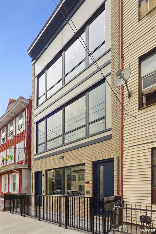 Welcome to Jersey City Heights and this premier newly constructed condominium, offering an exceptional blend of modern luxury, thoughtful design, and superior craftsmanship. Nestled in one of The Heightsâ€™ most sought-after neighborhoods, this residence delivers the perfect balance of elegance, comfort, and convenience. Step inside to a bright, open-concept layout featuring a designer kitchen appointed with custom cabinetry, a stunning quartz waterfall island, matching quartz countertops, and premium stainless-steel appliances. The spacious living and dining areas flow seamlessly, anchored by a stylish built-in electric fireplace that creates a warm and inviting atmosphere. This beautifully crafted home offers three generously sized bedrooms and two full bathrooms, including a luxurious primary suite designed for comfort and relaxation. Rich 100% white oak flooring extends throughout while custom closets, central heating and cooling, and a dedicated laundry room provide both style and functionality. Enjoy your private outdoor terrace, the perfect space for relaxation, or enjoying your morning coffee. Ideally located just minutes from NYC bus and rail transportation, acclaimed restaurants, shopping, parks, and highly regarded schools; this home offers unparalleled accessibility and convenience. Additional features include a comprehensive 10-year builderâ€™s warranty, providing peace of mind for years to come.