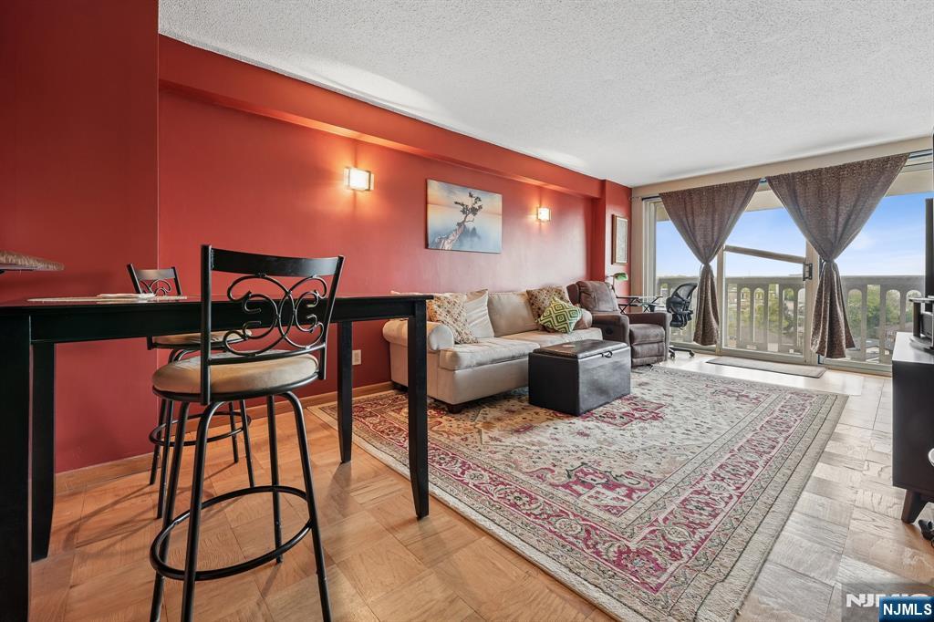 Cute 1 bedrm, 1 bath, open kitchen,terrace--low monthly--1192. Maintenance includes re tax, heat, air conditioning, water, electric, live in super, new gym. NJ TRANSIT BUS 158 at the door. New gym, community rm, mini-mart with fresh food, and Olympic sized outdoor pool (membership). SPECTRUM OR FIOS -in bldg--pick your provider. Spectrum bulk deal.Parking--$60.00 indoors or $55.00 outdoors.