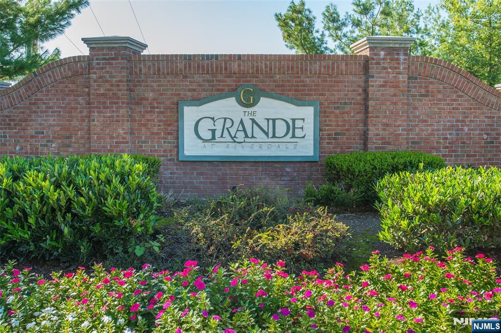LIVE THE GRANDE LIFE! INTERIOR PHOTOS COMING SOON! So many upgrades in this beautiful 2 bedroom, 2 bath condo on the 3rd flr with elegant living space. In the past year, new heating & cooling system, new hot water heater, replaced carpet with Luxury Vinyl Tile throughout. Over $25,000 in upgrades! Open floor plan with lots of natural sunlight! Corner unit facing the front of the building. Great location in building 5 which is directly across from the clubhouse & all amenities. Featuring 2 bedrooms w/walk-in-closet each bedroom. The primary bedroom has a full bath. There is a computer room/office. Bigger kitchen w/center island, beautiful kitchen cabinets, granite countertops. Balcony off kitchen dining area. Laundry room accommodates full size washer & dryer side by side! Amazing low Riverdale taxes only $6,805. 1 Car assigned parking space in garage with elevator access and additional parking outside of building. Experience the Grande life with a wealth of amenities, including 2 clubhouses equipped with fitness centers, billiards rooms, conference rooms, party rooms, tennis and basketball courts, 2 swimming pools, and much more! Enjoy a fantastic location with easy access to major highways, shopping and restaurants. PET POLICY- MAX 2 PETS-35LB WEIGHT LIMIT PER PET.