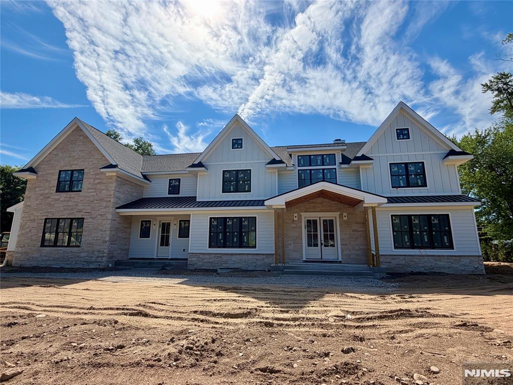 Introducing spectacular new construction in Urban Farms by High Peak Homes, LLC, a respected builder known for exceptional craftsmanship, delivering custom-grade millwork & finishes that far exceed a typical spec home. Sited on a cul-de-sac, this luxury residence was thoughtfully designed w/ elegance & everyday living in mind, offering two separate entrances. A dramatic two-story foyer welcomes guests, while a family entrance leads into an oversized mudroom to stow boots, backpacks, and clutter.4 fplcs enhance this stunning home. The gourmet kitchen features two center islands, premium finishes, a butler's pass, scullery w/ ovens, refrigerator & prep area. A first floor bedroom suite with its own private patio provides privacy for guests or extended family. A 10-foot glass partition opens fully to a covered rear patio w/ outdoor kitchen and fireplace, seamlessly merging indoor and outdoor living. The upper level offers the primary suite, a spa-inspired bath w/ radiant heated floors & a custom digitally controlled double shower, 3 more generously sized bedrooms with full baths and a spectacular great room with fireplace, offering an elegant retreat for family and guests alike. A fully finished basement delivers a wet bar, gym, rec room, dedicated movie theater & wine cellar prepped for owner fit-out. 3 car garage w/ 2 EV chargers completes this truly exceptional offering. Pool approval in place. Renderings are for artistic representation. Finishes & details may vary