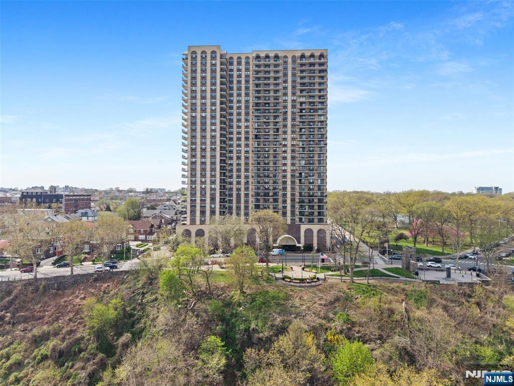 Exceptional value meets breathtaking views in this beautifully maintained 1-bed condo offering unobstructed NYC skyline and Hudson River views. Adding even more appeal, the Seller will pay the existing special assessment in full at closing & is offering an additional concession covering the buyerâ€™s escrow pre-pay requirement (3 months HOA) and capital contribution fee (2 months HOA). These outstanding benefits significantly reduce upfront closing costs and enhance overall affordability! Inside, this light-filled residence offers a move-in-ready layout designed for everyday living. Features include WTW carpeting, recessed lighting, abundant closet space, & a generously sized bedroom w a walk-in closet and stunning city views. The full bath includes a tub/shower combo, while the bright living area opens to a large private balconyâ€”showcasing the backdrop of the NYC skyline & Hudson River. Conveniently located near parks, shopping, & transportation, NJT bus service is available directly outside the building for an easy commute. Building amenities include a fitness center, available parking, and on-site laundry located on the same floor for added convenience. Additional building enhancements are already underway, including a renovated pool anticipated to reopen in late Summer 2026 and a modernized lobby expected to be completed by July 2026. A rare opportunity to enjoy spectacular views, outstanding convenience, and exceptional overall value in a highly desirable location.