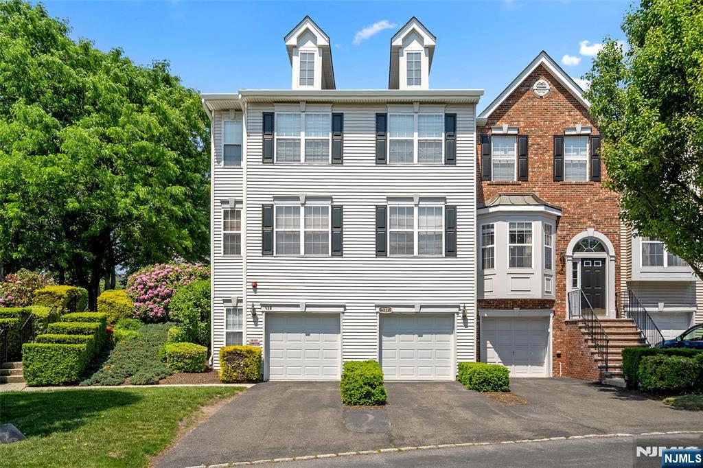 Nestled in the prestigious gated community of Cambridge Heights, this beautifully updated townhome blends comfort, style, and convenience. Featuring 2 bedrooms and 2 baths, the home showcases warm wood floors throughout, a sun-filled eat-in kitchen with modern appliances, and spacious living and dining areas perfect for entertaining. The two generously sized bedrooms, including a primary suite with an en-suite bath, all conveniently situated on the same floor. The walkout lower-level family room provides the perfect flexible space for a media room, home office, or gym, with direct access to the attached one-car garage and ground-floor laundry. Residents enjoy an array of resort-style amenities, including a pool, fitness center, tennis courts, playground, and clubhouse, along with easy access to shopping, dining, and major commuting routes.