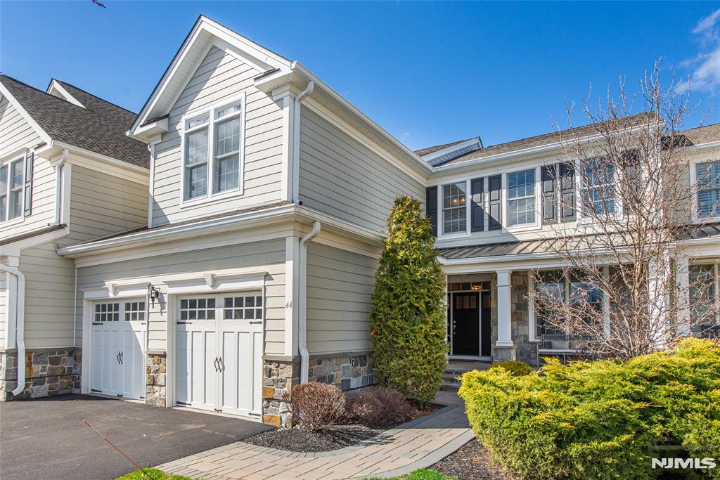 Welcome to this stunning 3 bedroom, 2 full and 2 half bath townhouse at The Reserve at Franklin Lakes. Built in 2018 and located in a sought after location within the community boasting peaceful wooded views, this 3,020 square foot home plus a finished basement has an impressive two story entry foyer which leads to a formal dining room complete with a butlerâ€™s pantry. The well appointed gourmet kitchen with a large center quartz island opens to the great room with a cathedral ceiling and gas fireplace which overlooks the expanded TimberTech deck complete with perimeter lighting. The first floor primary suite is complete with a luxurious spa-like bath and spacious custom walk-in closet. Heading upstairs you will find two additional spacious bedrooms which share a Jack and Jill bathroom, the home office plus a large loft area perfect for a cozy seating area or second living space. The large finished basement provides additional flexible space including a recreation area and room for a home gym, powder room and plenty of storage. Additional features include hardwood floors throughout the first and second floors, mudroom, a two car garage with a Tesla wall charger, alarm system and so much more. Resort style amenities include clubhouse, pool, tennis, pickleball, gym and walking trails offering an active and social lifestyle.