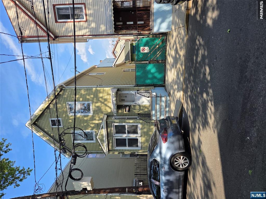 A single family home with added space and a private driveway, ideal for buyers looking for a project or investment opportunity. The home will required updates, and it sits in a busy neighborhood.