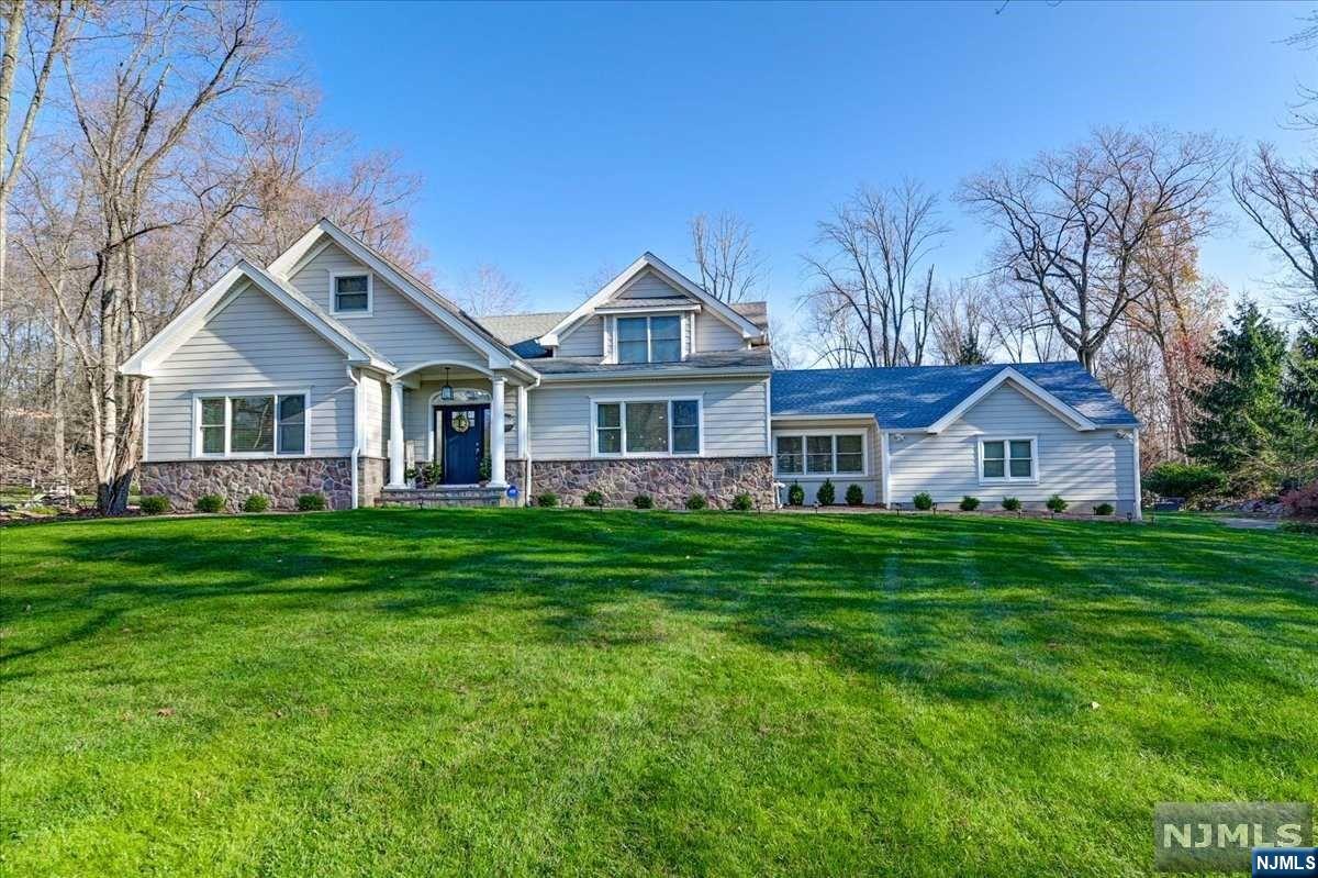 NEWLY UPDATED DREAM HOME SITUATED ON A PARK LIKE SETTING WITH OVER 5000 SQ FT ACROSS THREE LEVELS. UPON ENTRY YOU ARE GREETED BY A BRIGHT 2 STORY ENTRY FOYER W/CUSTM ILL WORK, STUNNING HW FLOORS & STAIRCASE. FABULOUS OPEN FLOOR PLAN W/LR W/FP, DR & OVERSIZED KITCHEN. KITCHEN OPENS TO A LARGE 3 SEASON RM. THE 1ST FL PRIMARY SUITE IS YOUR PRIVATE ESCAPE, W LUX BATH, 2 WIC & 2 ADDT CLOSETS. A POWDER RM, LNDRY RM, & BONUS RM/DEN FINISH OUT THE FIRST LEVEL. LEVEL 2 OFFERS BR W/EN SUITE, 3 ADDT LARGE BR'S,& HALL BATH. THE LOWEL LEVEL IS AMAZING BOASTS A MEDIA RM, REC AREA, GYM/BONUS RM & WINE CELLAR, AND AMPLE STORAGE. NEW ROOF, NEW HEATING,SECRTY, SMART HOME FEATURES.TOO MANY TO LIST. TOP RATES SCHOOLS, LOW TAXES, HURRY ON THIS ONE. OWNER HOLDS NJ RE LICENSE.