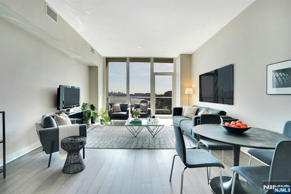 Luxury Apt at THE AVENUE COLLECTION, stunning waterfront development, steps from Port Imperial ferry offering easiest NYC Commute via NY Waterway. This spacious 1431-SF south facing 2 bedrooms unit features open floor plan, top of the line Appliances and Fixtures, gourmet kitchen with stainless steel appliances and granite counters. Large primary bedrooms with ensuite bathrooms and large walk-in closet. Spectacular amenities: full time Doorman, state of the art fitness center, outdoor pool, kids playroom, movie room, top-floor lounge with NYC view available for shared and personal use, shops on-site & more! Near parks, rec. facility. Whole Foods, Light Rail/Path or NJ Transit nearby.