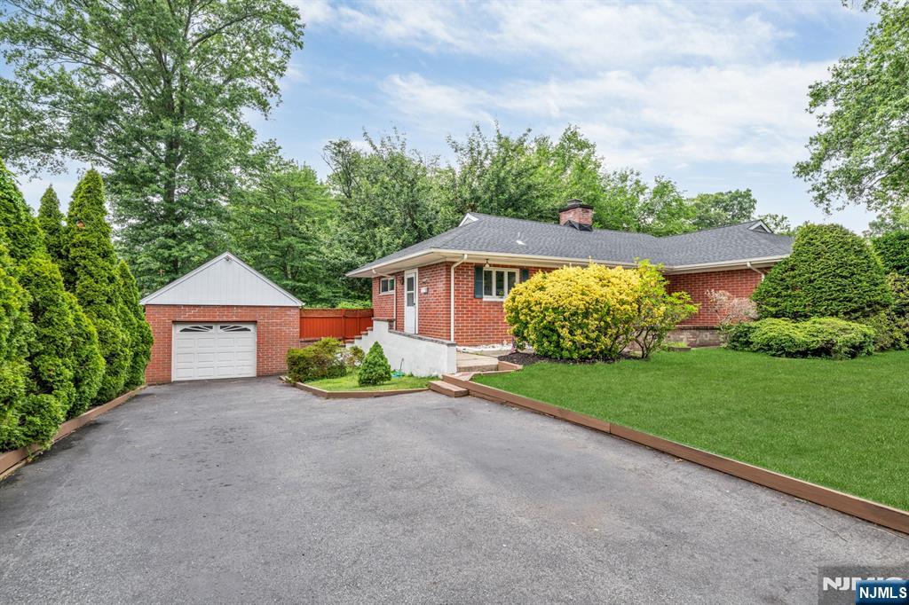 Welcome home to this perfectly located 3 Bedroom / 2 Bathroom Ranch situated on a gorgeous 100 X 100 lot behind Clark Field in highly sought after Washington Township. Featuring hardwood floors throughout, wood burning fireplace, central AC / forced hot air heat, ample sunlight throughout the day, and one car detached garage, this home is sure to please. Main level features entry foyer, living room w/ fireplace, Chef's kitchen, three spacious bedrooms, and full bath. Chef's kitchen includes granite countertops, custom cabinets, breakfast bar, and sliders to backyard. Finished basement features family room w/ bar, office / storage room, full bathroom, laundry, storage and utilities. Completing this home is a beautiful, lush backyard with patio and easy access to Clark Field. Located near plenty of shopping, parks, restaurants, public transportation, major highways, and award winning schools. Ready for your own personal touches, this is one you truly don't want to miss!