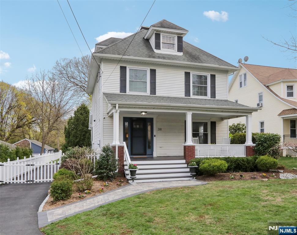 This timeless colonial has been beautifully reimagined for present living and entertaining. The deep open front porch welcomes you into the large foyer and you immediately sense the graciousness which high ceilings offer. Four sun fulled bedrooms are all on the second floor, with a possible fifth bedroom, or work room, on the third floor. This home has a reverse osmosis water filtration system, full house water softener, all new windows, an oversized new driveway and a deep fully fenced rear yard. A custom deck with contemporary railings and tiered entertainment area with a place for your outdoor TV creates the perfect gathering place for friends and family enjoyment! Enjoy Ridgewood Blue Ribbon schools and being steps away from the train, bus, and our vibrant downtown!!