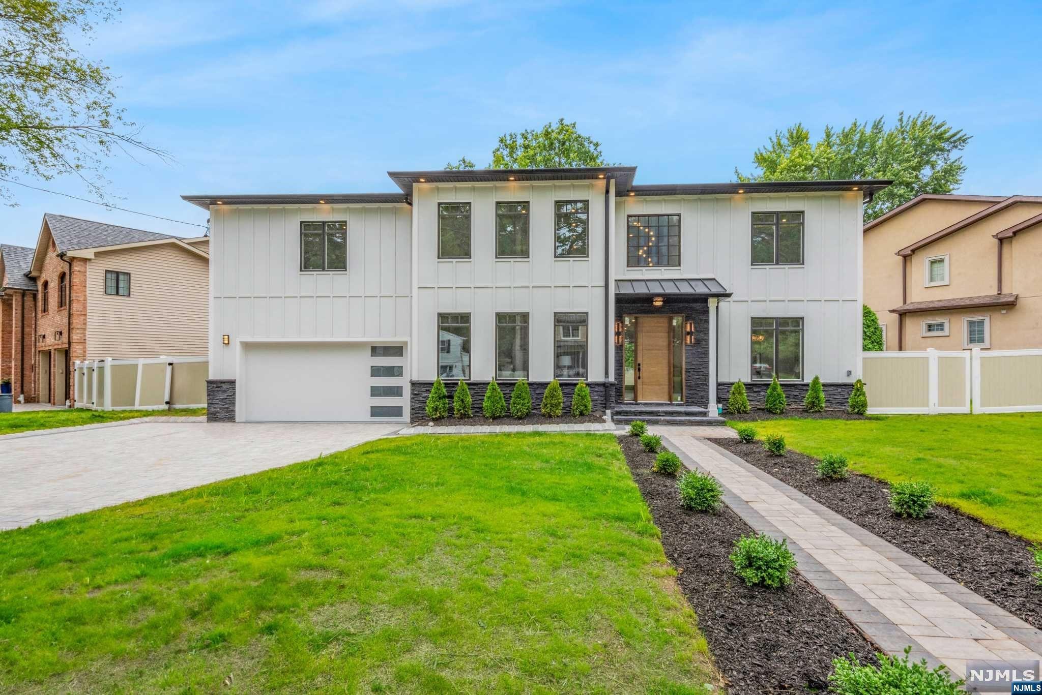 On NEW FOUNDATION. Indulge in the epitome of luxury living with this exquisite modern masterpiece, boasting 6 bedrooms, 5.5 bathrooms, and a generous 5500 square feet of living space. Step into the dramatic 2-story foyer, it's clear that no detail has been overlooked, with custom woodwork throughout and designer cabinetry and luxury appliances in the kitchen, complete with a grand island for entertaining. Upstairs, the primary suite is a tranquil oasis, featuring custom closets and a spa-like bathroom with a soaking tub, double vanities, and rainfall shower. Fully finished basement includes a movie rm, rec rm, and full bath, creating a haven of relaxation and entertainment. You'll enjoy year-round comfort with high-reflex double insulation, Hardie plank fiber cement siding and a full house generator, providing peace of mind in any weather. Situated in the highly sought-after Paramus area, minutes from Van Sun Park, malls, dining, and major highways, this location is simply gold.