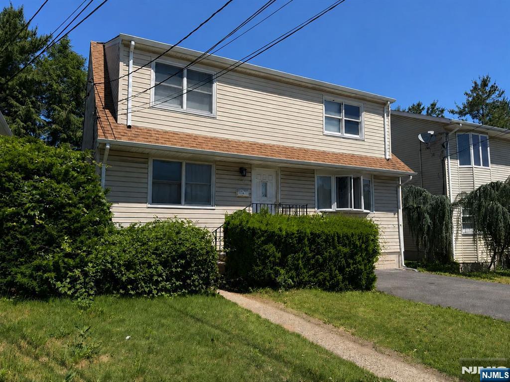 Excellent opportunity to own a spacious two-family home in one of East Rutherford's most convenient locations. The first-floor unit offers 3 bedrooms and 1 full bath, while the second-floor unit features 2 bedrooms and 1 full bath, making this property ideal for owner-occupants, investors, or multi-generational living. The unfinished basement provides excellent storage space and is equipped with a comprehensive water management system including French drains and three sump pumps. Perfectly situated adjacent to McKenzie School and McKenzie Field, offering easy access to recreation, sports, playgrounds, and community events. Conveniently located near shopping, dining, parks, NJ Transit bus and rail service, Routes 3, 17, 46, 21, I-95, the NJ Turnpike, and just minutes from New York City. Strong rental and long-term appreciation potential in one of Bergen County's most desirable commuter communities. Property being sold as-is.