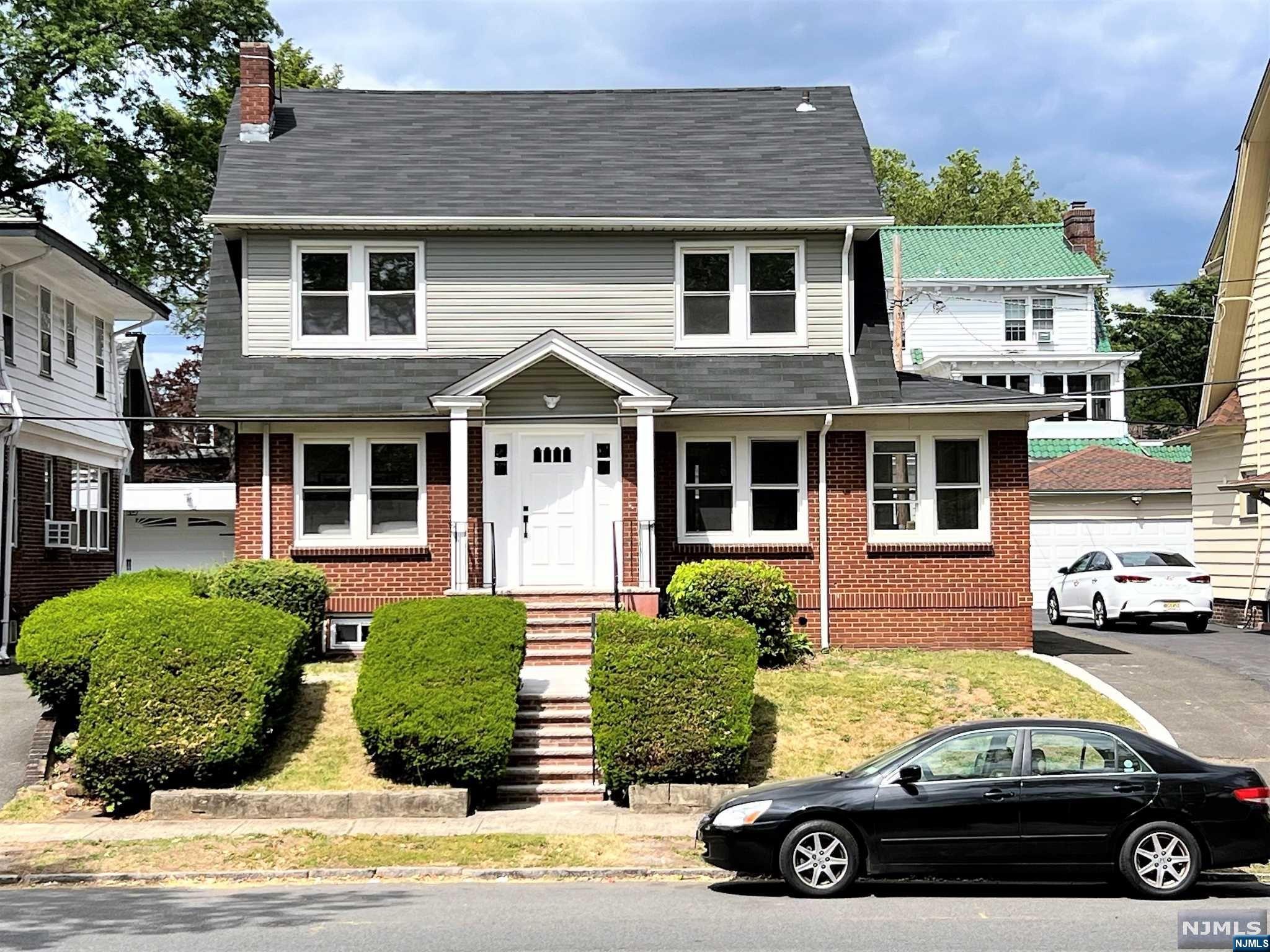FULLY RENOVATED!!! Large 4 Bedroom Colonial Home Hosts 2,221 SF of Living Space. Peacefully Nested on Chancellor Ave in the Weequahic Section of Newark. 1st Floor features Tiled Entry Foyer, Grand-Sized Living Room w/Wood Burning Fireplace, Formal Dining Room, Rec Room, Eat-In-Kitchen w/Quartz Countertops & S/S appliances, and a Full Bath. 2nd Floor Includes 4 Spacious Bedrooms, and 1 Full Bath. 3rd Floor is the Finished Attic; One Large Room w/New W/W Carpeting. Basement is Full & Unfinished. It Hosts a Spacious Main Room, New Full Bath, Laundry Area, Separate Utility Room, and Storage Room. Highlights include New Roof, New Vinyl Siding, New Multi-Zoned HVAC System (Central Air/FHA), New Plumbing, New Kitchen, New Bathrooms, Hardwood Floors, 3+Car Driveway. Conveniently Located next to Schools/Shopping/Highways, and Much More!