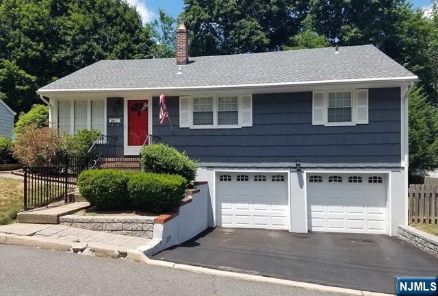 Looking to move to a great town with excellent school system, outstanding pool and recreation? Look no further! Beautiful home located on a quiet dead end street close to School, NY transportation. House is facing South, allowing lots of natural light to living room, dining room and bedrooms. The large family Room offers many windows and a bay window overlooking the private back yard. Direct exit to a brick paved patio and BBQ area. Great ranch style home with a brand new central air/heating system, new dishwasher and new refrigerator. Enjoy a dry basement with a full bath and plenty of storage area and laundry.