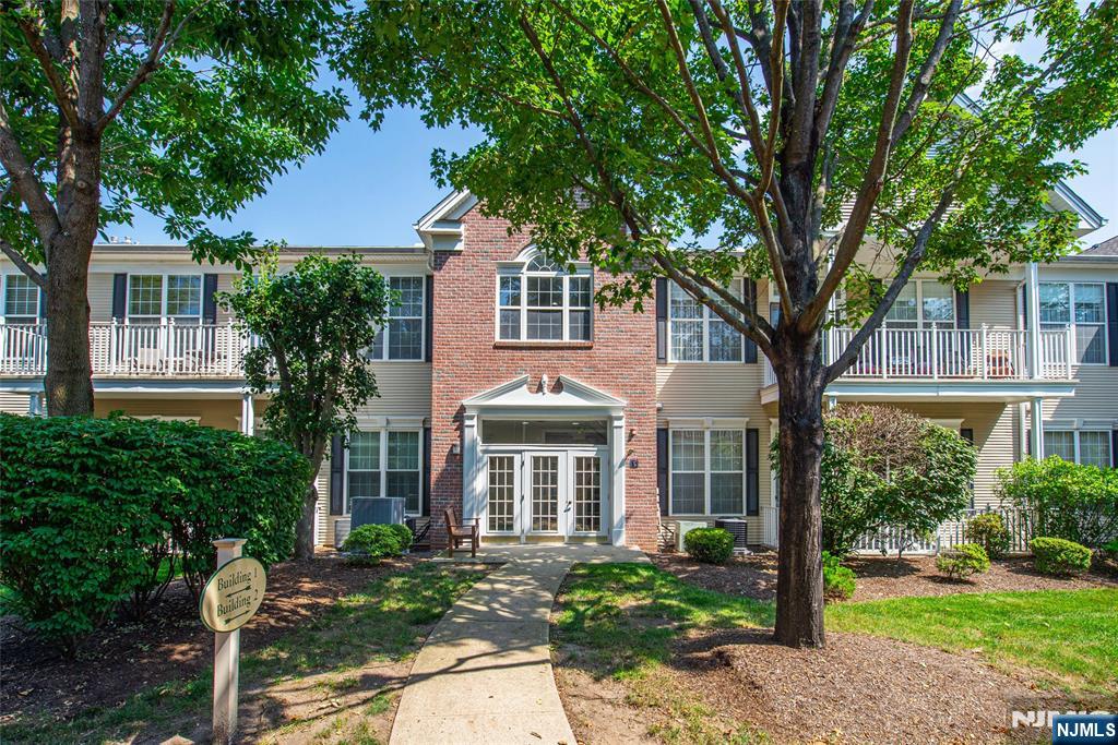 Welcome to Four Seasons at Wayne, one of the area's most sought-after 55+ active adult communities. This beautiful first floor Cherry model offers high ceilings, abundant natural light, and an open floor plan with living and dining areas enhanced by hardwood floors. The eat-in kitchen provides ample cabinet and counter space with sliders to your private terrace. Two large bedrooms include a primary suite with a stall shower, double vanity, and walk-in closet. Additional features include a laundry room with washer and dryer, indoor garage parking with elevator access, a large storage room, and shared hallway storage. Entire unit has been professionally cleaned and ready for move it! Enjoy a resort-style lifestyle with a clubhouse, pool, pickleball, billiards, fitness center, library, and bocce. Conveniently located near Whole Foods, Trader Joe's, the new ShopRite and Aldi, town activities, restaurants, major highways, NJ Transit, and the bus center. This home offers the perfect combination of comfort, convenience, and community living.
