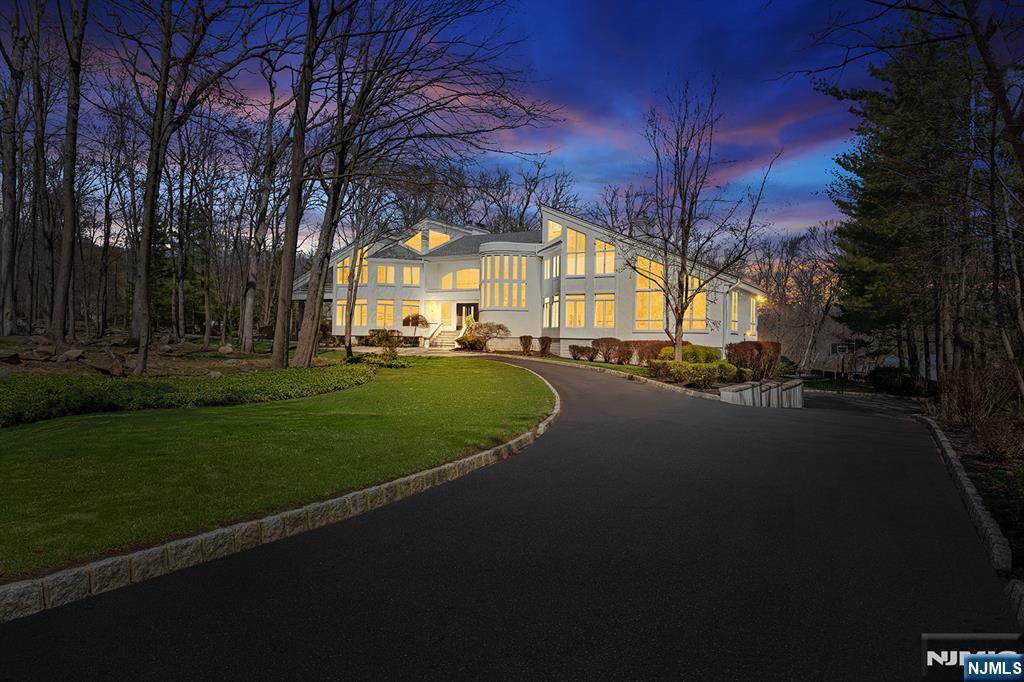Wake up each day to breathtaking lakefront views in this striking modern home, set within the gated Smoke Rise community on one of its most coveted streets. Defined by walls of glass and clean architectural lines, the home is designed to maximize natural light and a seamless connection to the outdoors. Live and entertain with ease as the home offers: a dramatic great room with soaring ceilings, multiple living spaces, a chefâ€™s kitchen with high-end finishes, and access to a rear deck overlooking the water. The lower level features a custom theater, recreation space, wet bar, fitness area, and walkout to the backyard. Outdoors includes a newly installed pool, sunken fire pit overlooking the lake, and curated landscaping. The setting, lifestyle, and location make this home one of a kind. Schedule your private tour today.