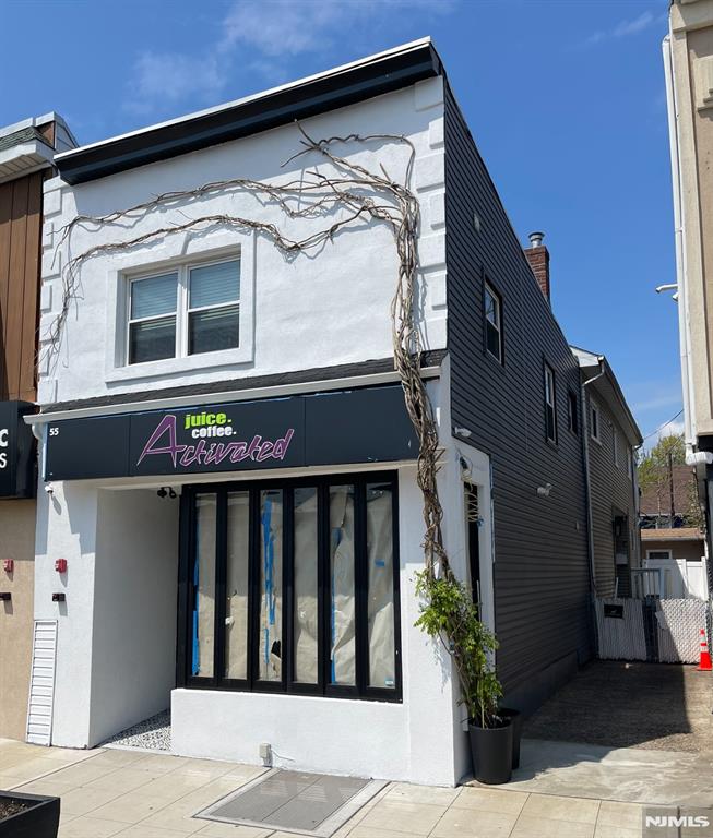 Situated in Garfieldâ€™s redeveloped sought-after â€œRestaurant Rowâ€ district, 55 Passaic St. is a fully leased four-unit mixed-use property featuring two commercial units and two residential units (one-bedroom and two-bedroom). The property underwent a full renovation in 2018, including new appliances, ensuring modern functionality and appeal. Additional features include a shared backyard and a semi-finished basement as an addition to the front commercial unit. This property is just one block from the train station and offers easy access to the Parkway, Route 46, and Route 80. This is a rare opportunity to acquire a well-maintained, income-generating asset in a high-demand area. Property is located in an opportunity zone and is sold as-is. Owner holds a New Jersey Real Estate License.