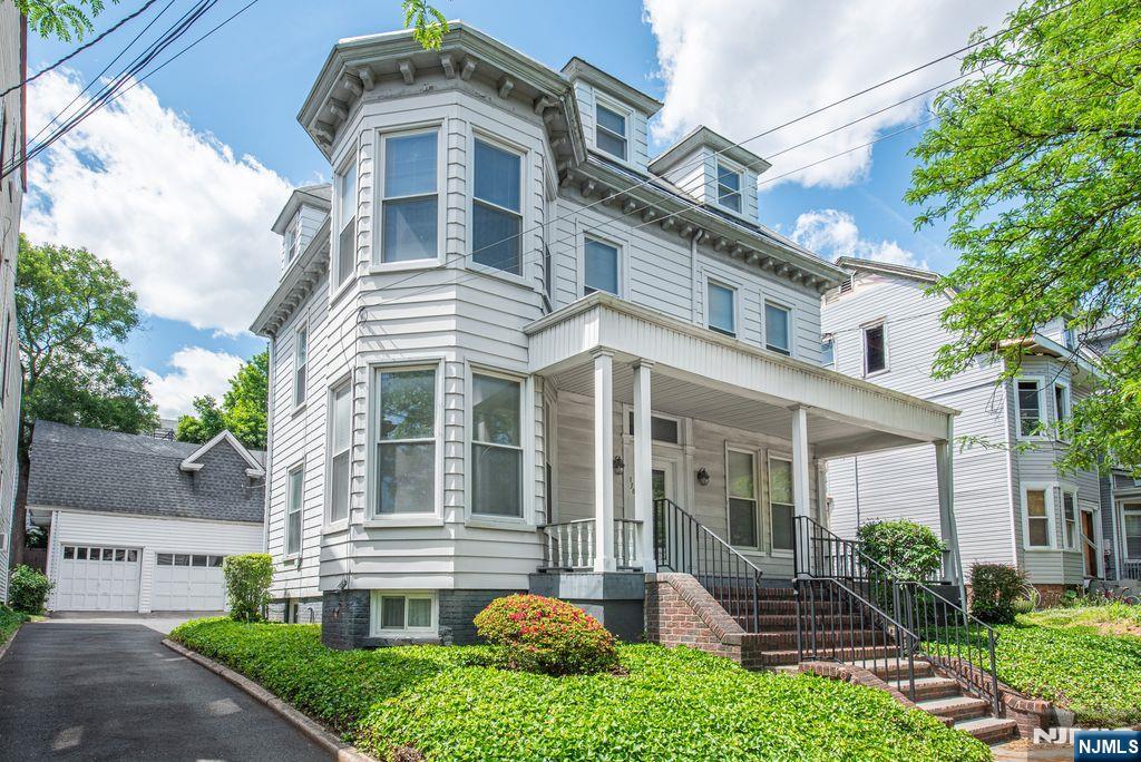 Restore/Reinvent/Recapture the essence of 334-336 Clifton Avenue. Discover the potential of this stately colonial home - brimming with architectural details - this residence offers a unique opportunity to restore its former grandeur! Key features include: 4 bedrooms, a spacious layout: generous room sizes with high ceilings - abundant possibilities with plenty of parking in/outside of the garage! Beautiful details: hardwood floors (beneath some of the carpeting) and classic woodwork awaiting restoration. Versatile spaces: multiple living areas, formal dining room, and potential for a home office or library. Located near Branch Brook Park - famously known for its amazing cherry blossom trees! This property is ideal for investors, renovators, or anyone looking to customize their dream home. Note: The home is being sold as-is. Bring your vision and creativity to breathe new life into this classic Newark gem. You got this - now make it happen!! Listing realtor related to Sellers.(The Zoning department has confirmed this to be a single family dwelling while be taxed as a 2 family dwelling - call zoning for more information. Confirm taxes and assessment values with tax assessor and note a tax revaluation is occurring as well.) Some images have been virtually staged and AI enhanced with renovations.