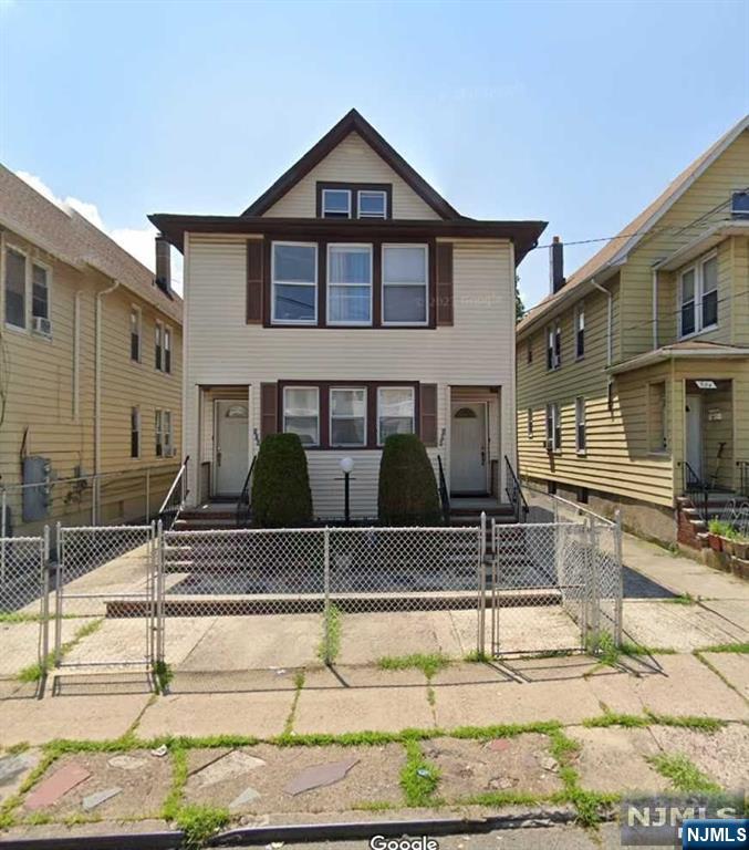 **Spacious Two-Family Home in Prime Location!** This large two-family property offers an exceptional investment or multi-generational living opportunity. Each floor features 3 generously sized bedrooms, perfect for comfortable living. The fully finished attic adds valuable space, complete with 2 additional rooms and a full bath, ideal for guests, an office, or a playroom. Enjoy the convenience of a two-car garage and separate utilities for each unit, ensuring ease of management. Situated in a great location, this home is close to local amenities, schools, major highways, and public transportation, making it a must-see for buyers seeking space and convenience. Don't miss out on this fantastic opportunity!