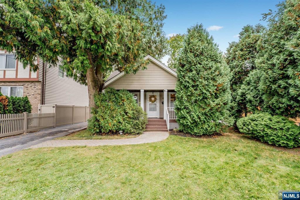 Discover the timeless charm of this renovated Cape Cod home, blending character and convenience. At approximately 1,960 sq ft, it features two freshly tiled baths, an open-concept main level, and a gourmet chef's kitchen leading to a large backyard deck. Highlights include a 36' Bertazzoni Italia gas stove with pot filler, insta-hot water, triple black granite countertops, hardwood floors, and original chestnut trim. The finished basement offers an office, yoga studio, and laundry room prepped for a third bath. Enjoy a fully fenced backyard wired for speakers, a detached garage, and a generator outlet. Located on a quiet street in Mahwah with top-rated schools, low taxes, and nearby amenities like ski slopes, hiking trails, shopping, and the train station. Just an hour to NYC, this turnkey home is ready for you to unpack and live life.