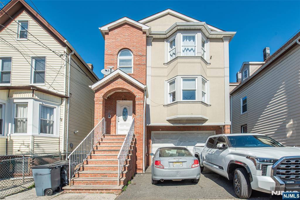 A RARE FIND!!! Welcome to the 2-family home that youâ€™ve been waiting for in the vibrant city of Elizabeth! Constructed in 2011, this property is ideal for owner-occupants looking to offset expenses with a tenanted top floor, but is equally an excellent choice for investors. Offering over 3,250 s.f. of living space, this special property has a total of nine bedrooms and five full baths. The Unit 1 duplex features four bedrooms and two baths on the upper level, plus a finished ground floor with living/dining area, kitchenette, bedroom and full bath â€“ accessed via an interior staircase or by separate private entrance. Top floor Unit 2 mirrors the Unit 1 upper level layout and is occupied on a M-T-M basis by great tenants that would love to stay. Thoughtfully designed for control over utility use, there are separate furnaces, central air units, and gas/electric meters for each of the three levels. Socialize and host barbecues with friends in the ample backyard and create a delightful garden to enjoy. In an area where on-street parking is scarce, there is covered parking for two cars in the garage and room for an amazing four+ cars in the oversize driveway. Enjoy easy access to parks and sports activities, NYC transportation, the NJ Turnpike, Newark Airport, plus shopping destinations such as Jersey Gardens, IKEA, and the near-by boutique retail and enticing restaurants of downtown Elizabeth. Make it your point to come and see this versatile home today!