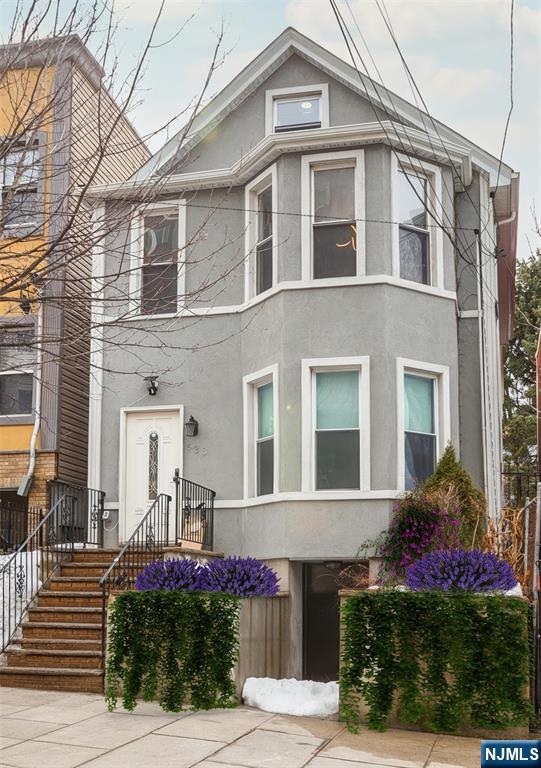 This exceptional two-family home in the vibrant community of Union City offers a generous backyard and limitless potential. Bathed in natural light from expansive windows and complemented by bright, modern finishes, each beautifully renovated unit features two spacious bedrooms and two full bathrooms. The second-floor apartment also includes a loft on the third level, providing additional versatile living space. Meticulously redesigned with architectural flair and contemporary upgrades, this property seamlessly blends style, comfort, and functionality creating an elevated living experience for both owners and tenants. The expansive backyard serves as a private retreat, perfect for gardening, outdoor dining, entertaining, play, or simply relaxing in your own outdoor oasis. Ideally located just moments from premier transportation to New York City, this home provides outstanding accessibility while remaining nestled in a neighborhood known for its strong sense of community and rich history. With convenient access to public transportation and major highways, commuting to NYC or working remotely is effortless.