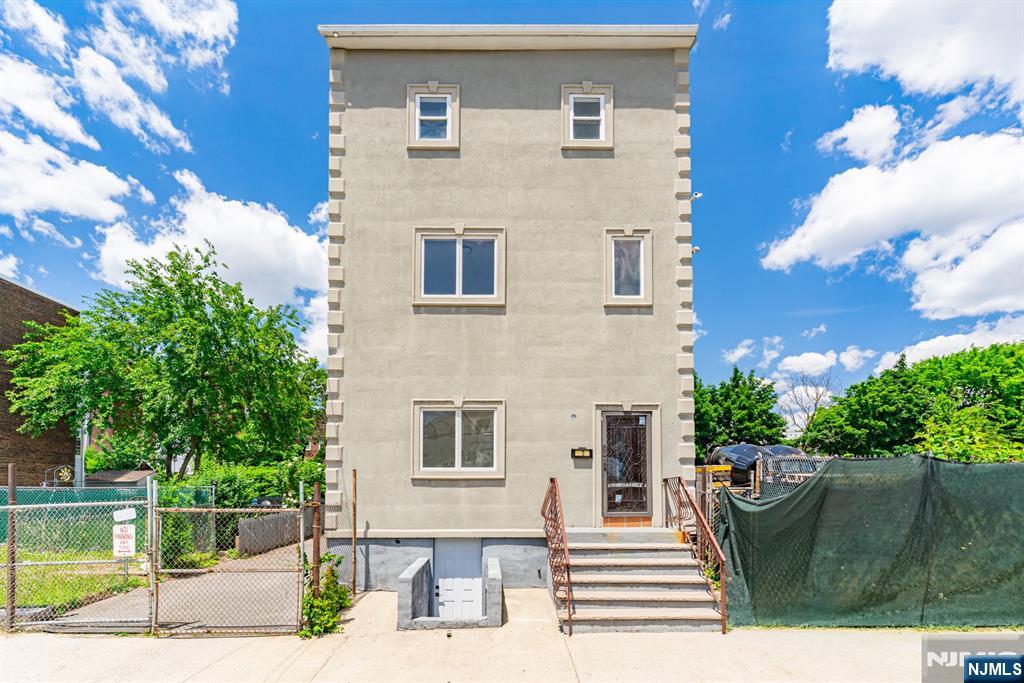 Totally Updated Legal 3-Family Investment Opportunity! This fully renovated and legally 3-family property offers an exceptional opportunity for both investors and owner-occupants. Featuring spacious units, a walk-out basement, ample off-street parking, and a large oversized garage, this property combines functionality with strong income potential. Conveniently located near major highways, Newark Liberty International Airport, public transportation, shopping, dining, and other everyday amenities, it provides easy access for commuters and tenants alike. Whether you're looking to expand your portfolio or live in one unit while generating rental income from the others, this versatile property is one you won't want to miss.