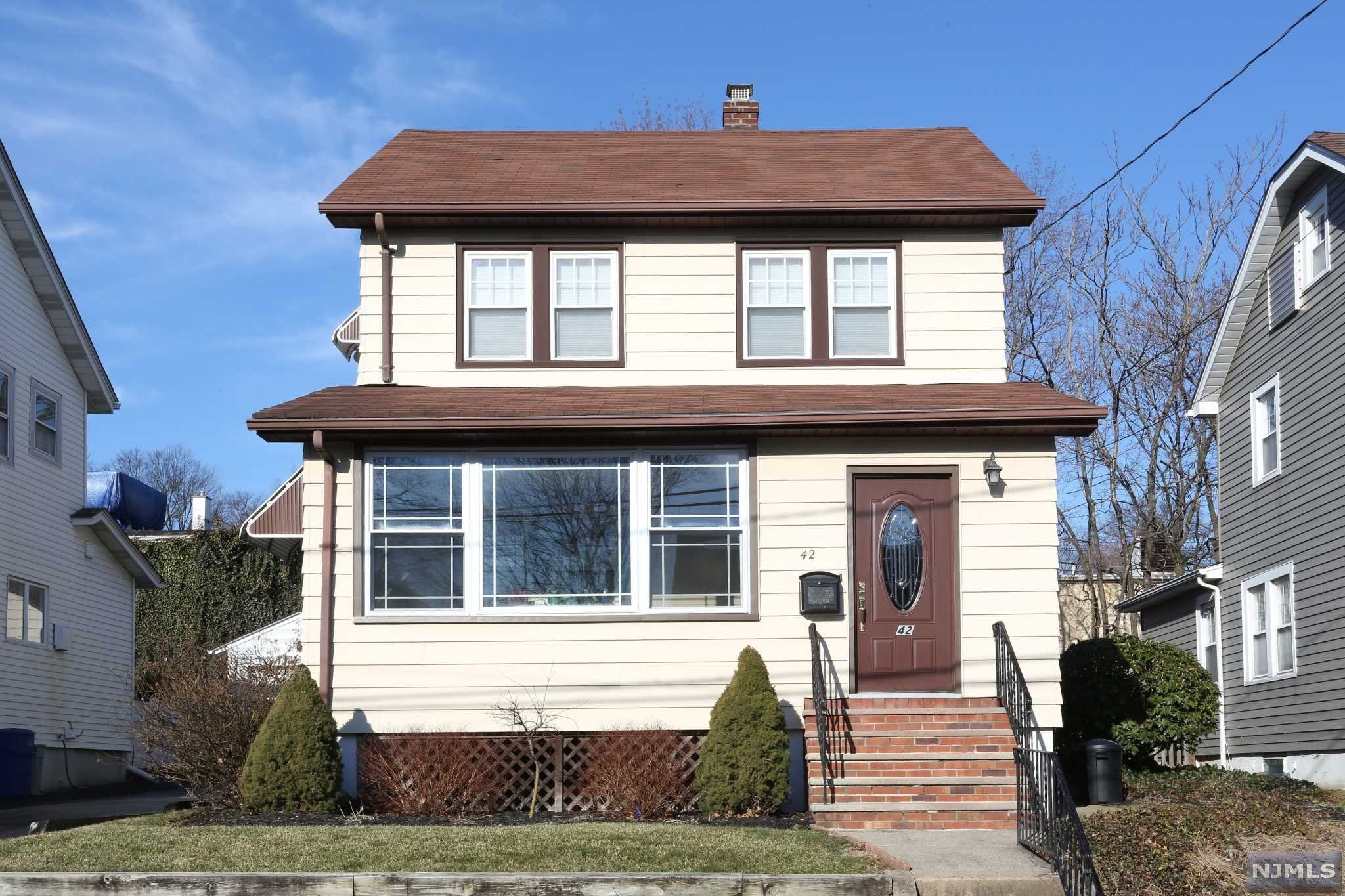 Your Oradell story awaits! Take the sidewalk to NYC bus/train, the new Oak Hill Grill and Hoffman Field & Playground. This very well maintained, fully landscaped home is on a quiet street. Masonry work is meticulous and there are hardwood floors throughout. You are greeted by a charming 3 season porch w/ updated windows. LR has so much natural light flowing through large windows, high ceilings. Good sized FDR. Roomy, functional kitchen with plenty of counterspace and oak cabinetry; so sunny w/ skylight and bay window. First floor also includes office/BR. Second floor has MBR, 2 more BRs and a full bath. Walk-up attic can be finished as a bonus room. Basement is partially finished w/a 1/4 bath in the utility room. Water Heater (2022) Furnace (2015). Fenced in manicured yard has a patio, sprinklers, and beautiful perennials. Shared Driveway has parking area w/oversized garage.