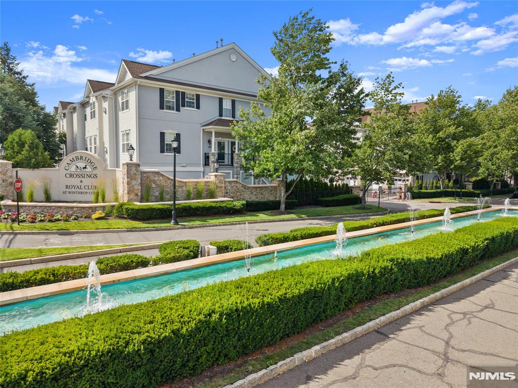 Welcome to this beautifully updated Woodcliff-model townhouse in the desirable gated community of Cambridge Crossings. Offering 2 bedrooms, 2.5 baths, and approximately 2,150 square feet, this home blends comfort and modern style seamlessly. The main level features a bright, open living room, a sleek modern kitchen, and a dedicated dining area that opens to a private deck perfect for relaxing or entertaining. A laundry room, convenient half bath, and access to the attached garage complete this level.Upstairs, the spacious primary suite impresses with a private bath, walk-in closet, and a versatile bonus area ideal for a home office or sitting room. A second oversized bedroom and an updated hallway bath round out this level. The third level offers a expansive loft space that can easily serve as a third bedroom, home office, or private workout area a truly flexible bonus that sets this home apart. Residents enjoy access to a clubhouse, fitness center, and swimming pool. With thoughtful finishes throughout and a prime location close to shopping, NY transportation, and major highways, this townhouse offers a truly effortless lifestyle.