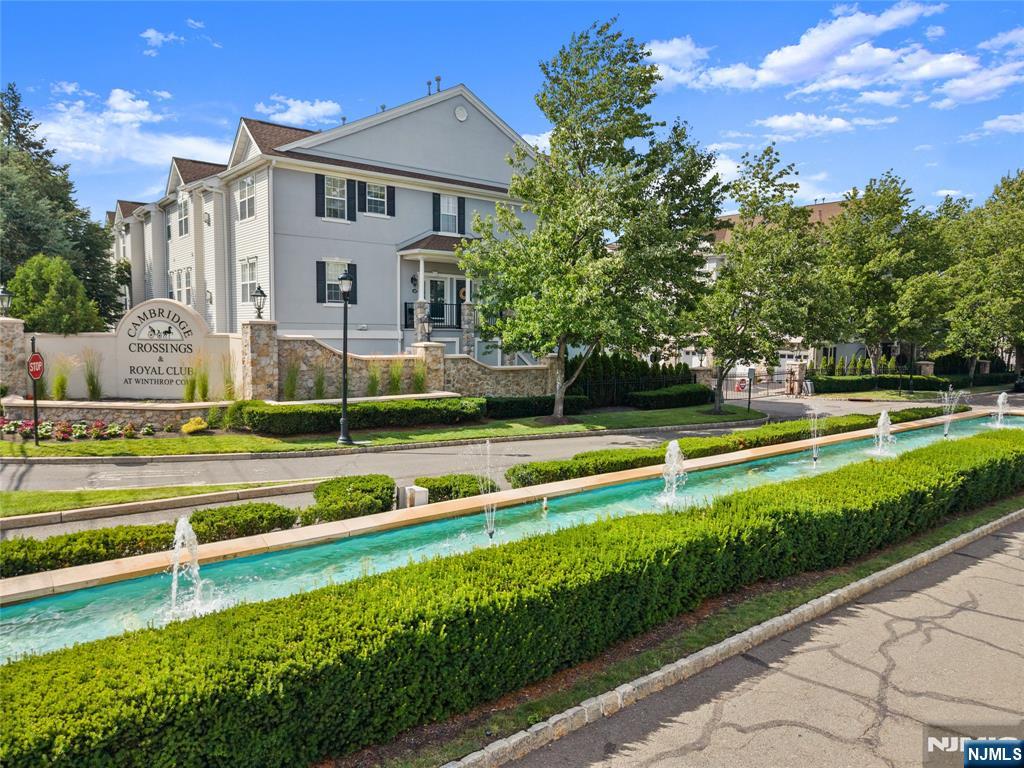 Welcome to this beautifully updated Woodcliff-model townhouse in the desirable gated community of Cambridge Crossings. Offering 2 bedrooms, 2.5 baths, and approximately 2,150 square feet, this home blends comfort and modern style seamlessly. The main level features a bright, open living room, a sleek modern kitchen, and a dedicated dining area that opens to a private deck perfect for relaxing or entertaining. A laundry room, convenient half bath, and access to the attached garage complete this level.Upstairs, the spacious primary suite impresses with a private bath, walk-in closet, and a versatile bonus area ideal for a home office or sitting room. A second oversized bedroom and an updated hallway bath round out this level. The third level offers a expansive loft space that can easily serve as a third bedroom, home office, or private workout area a truly flexible bonus that sets this home apart. Residents enjoy access to a clubhouse, fitness center, and swimming pool. With thoughtful finishes throughout and a prime location close to shopping, NY transportation, and major highways, this townhouse offers a truly effortless lifestyle.